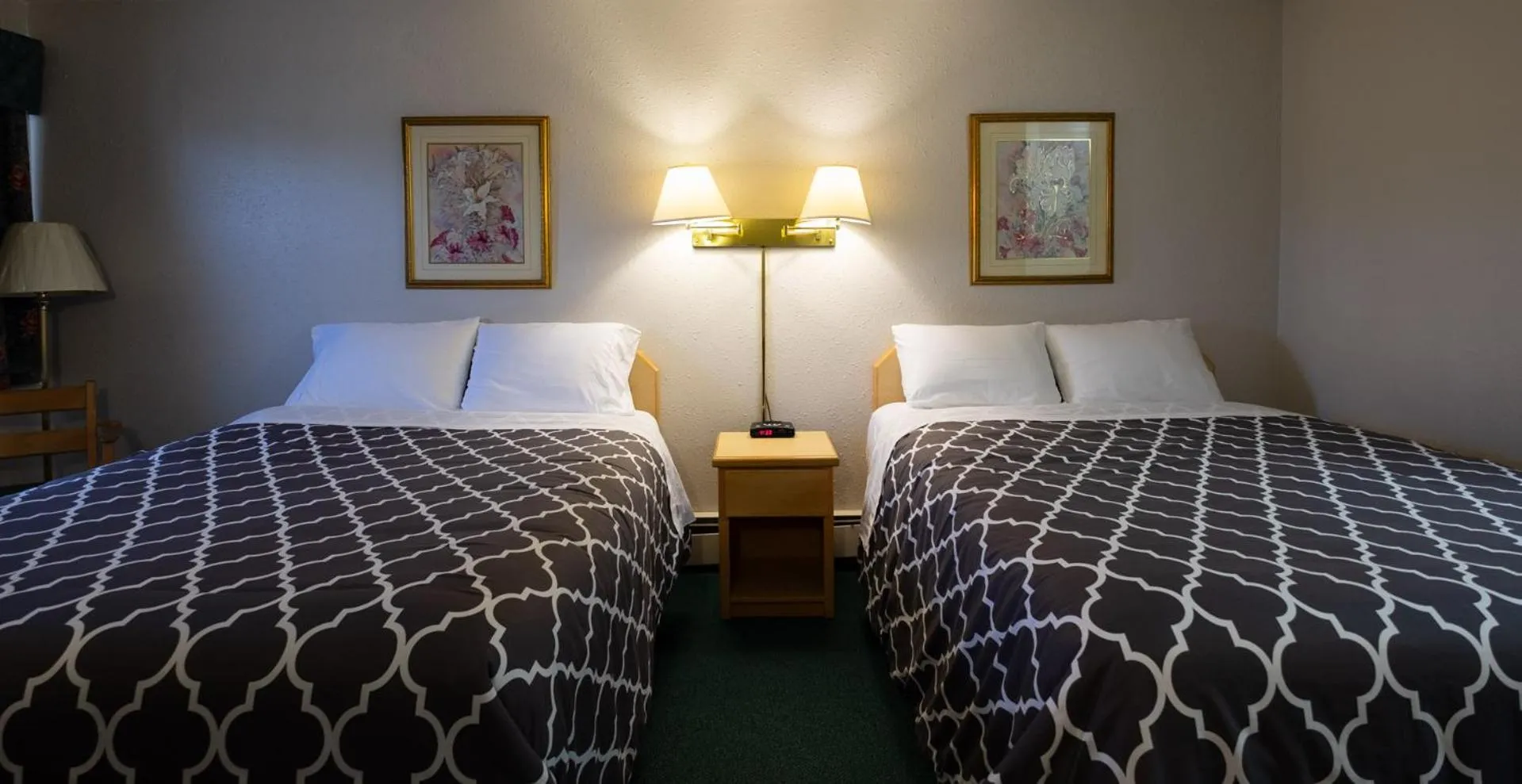 Bed in Perfect Inns & Suites