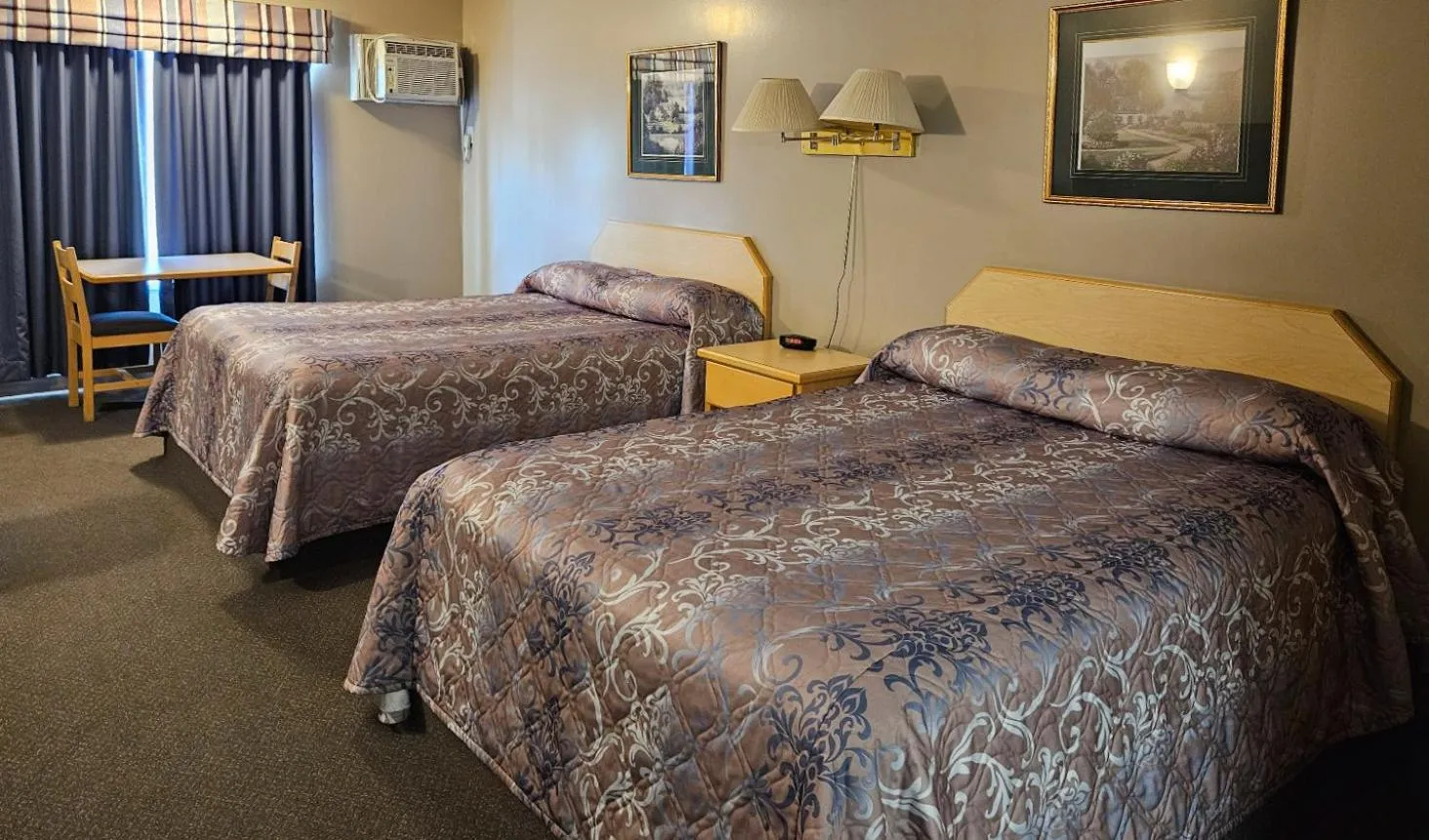Bed in Perfect Inns & Suites
