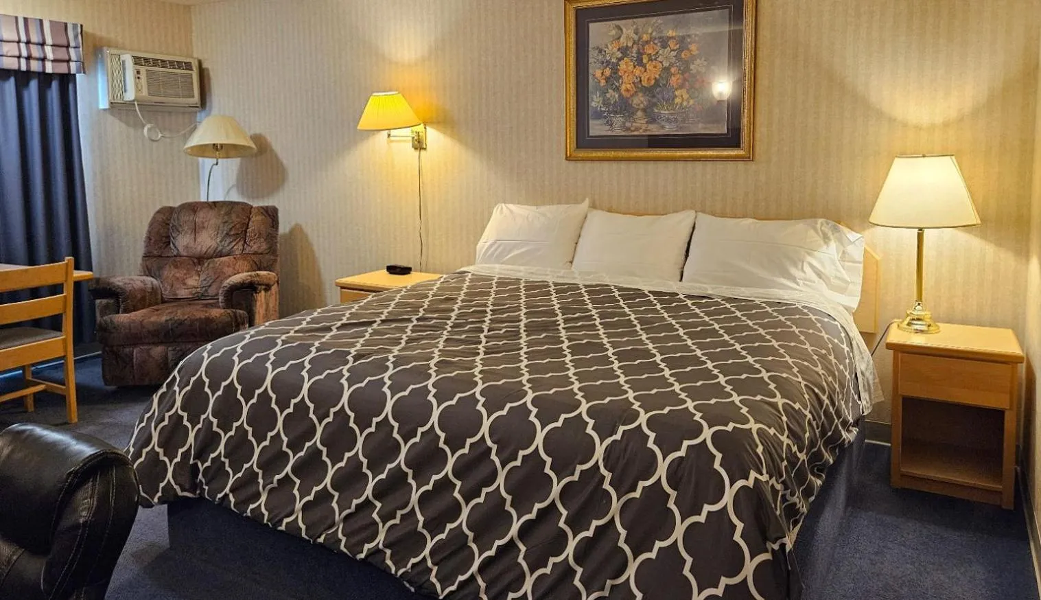 Bed in Perfect Inns & Suites