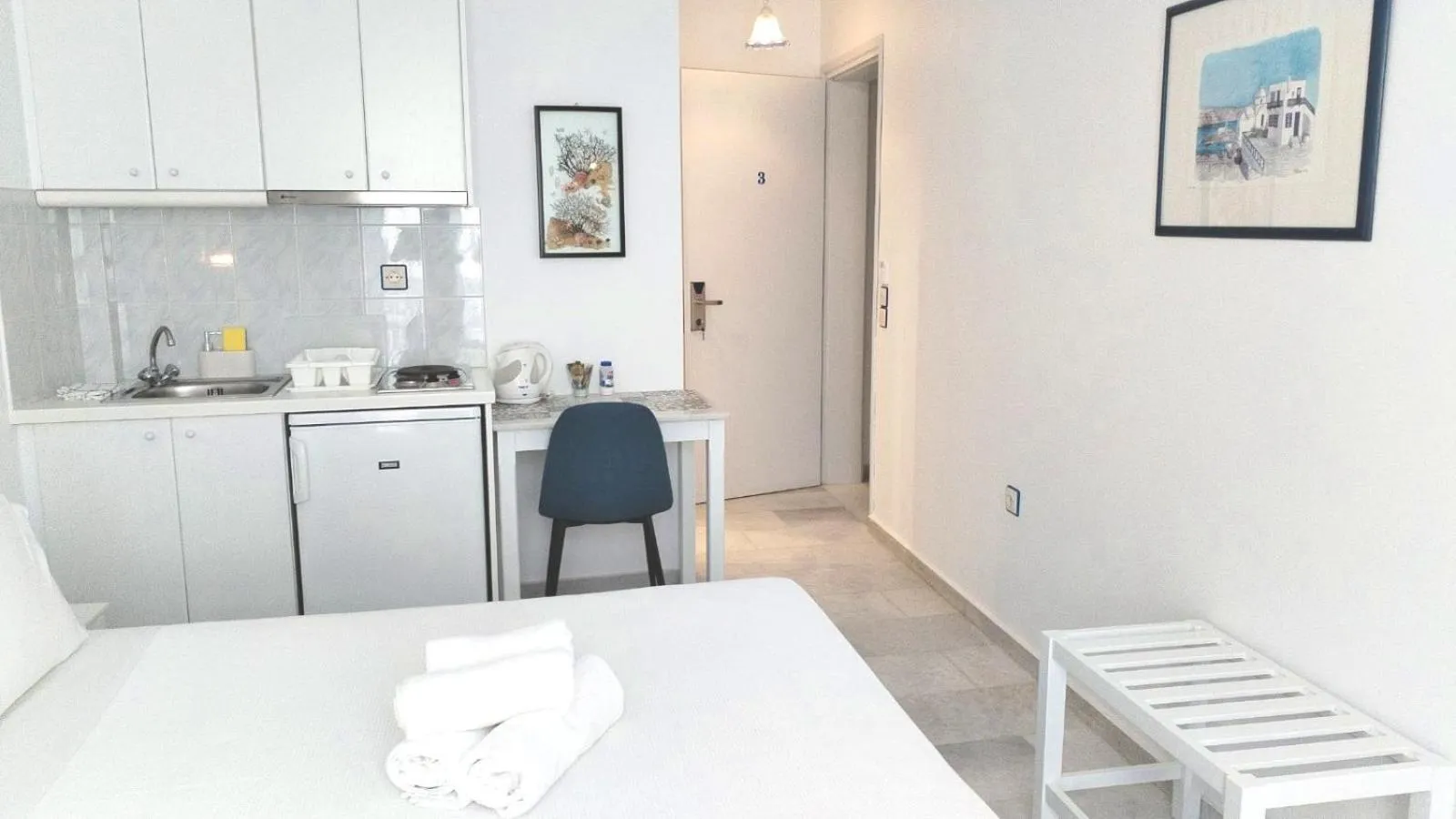 Kitchen or kitchenette, Bed in Nostos Studios at Saint George beach Agios Georgios Chora Naxos town