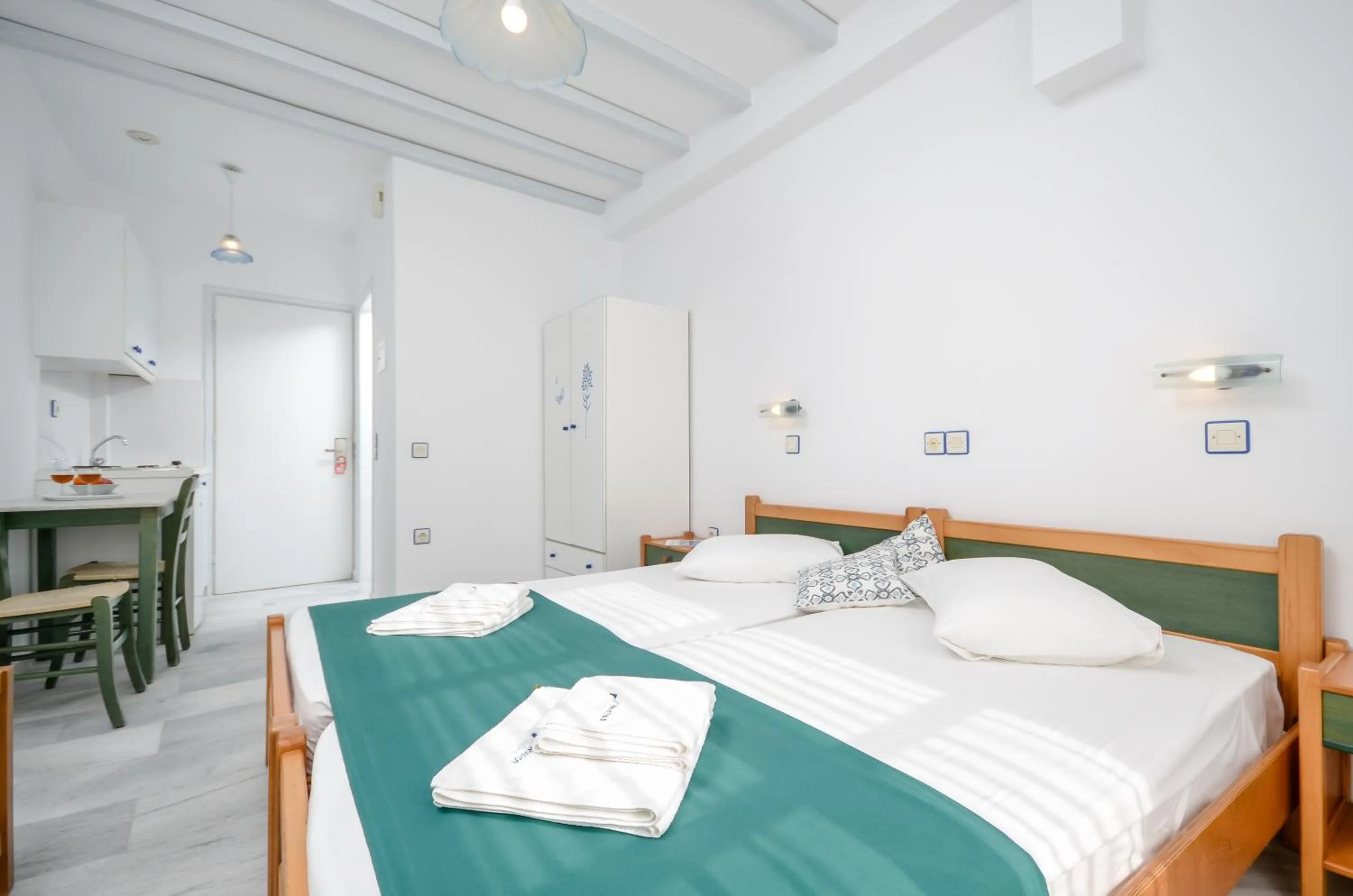 Spring, Bed in Nostos Studios at Saint George beach Agios Georgios Chora Naxos town