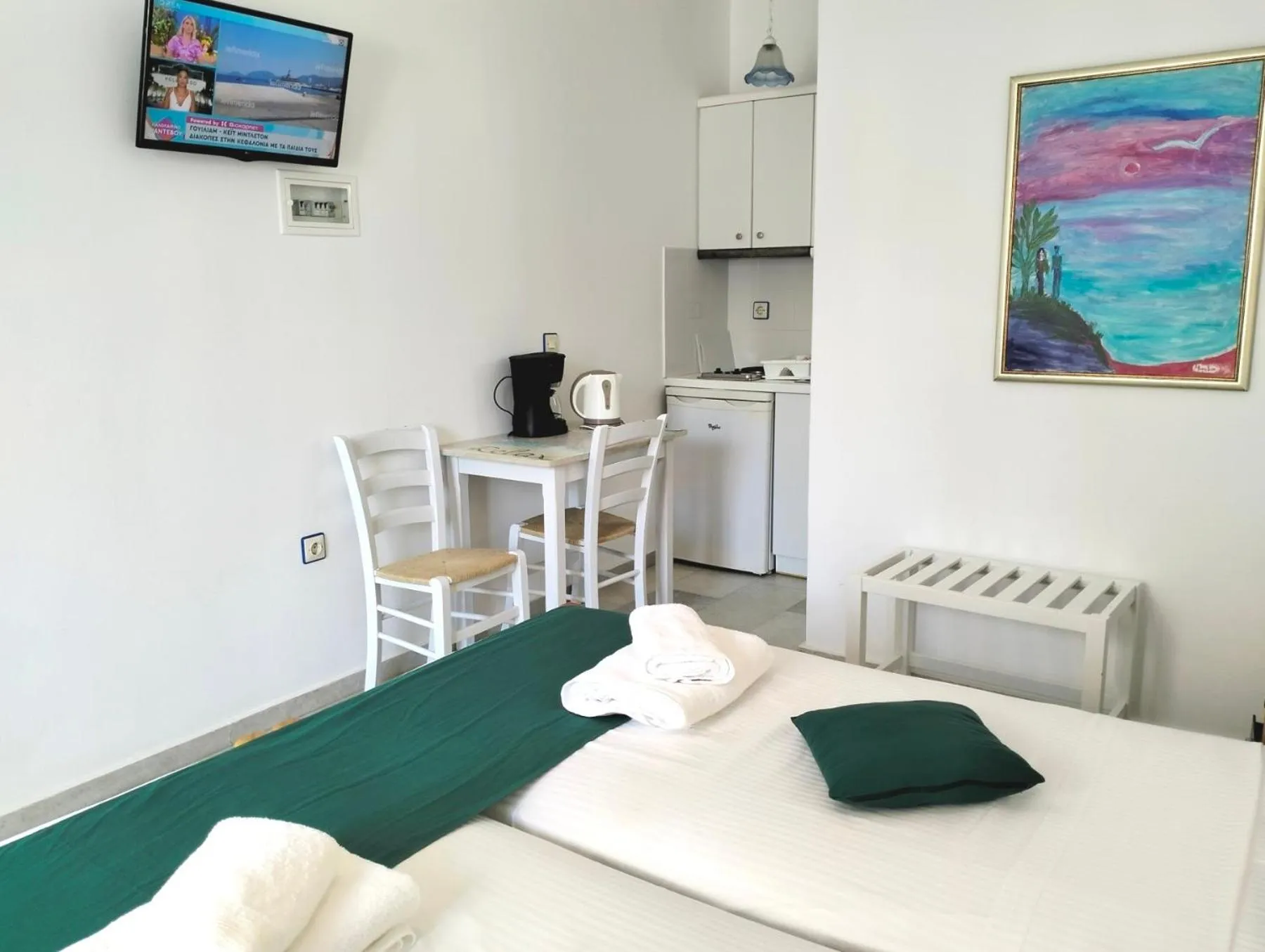 Kitchen or kitchenette, Bed in Nostos Studios at Saint George beach Agios Georgios Chora Naxos town