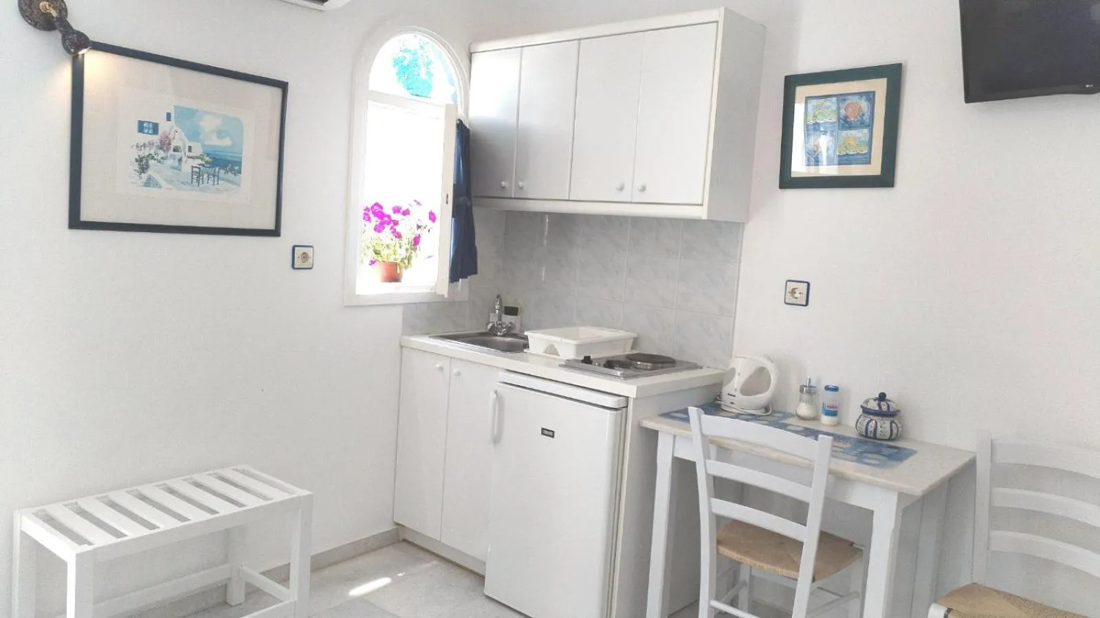Kitchen or kitchenette in Nostos Studios at Saint George beach Agios Georgios Chora Naxos town