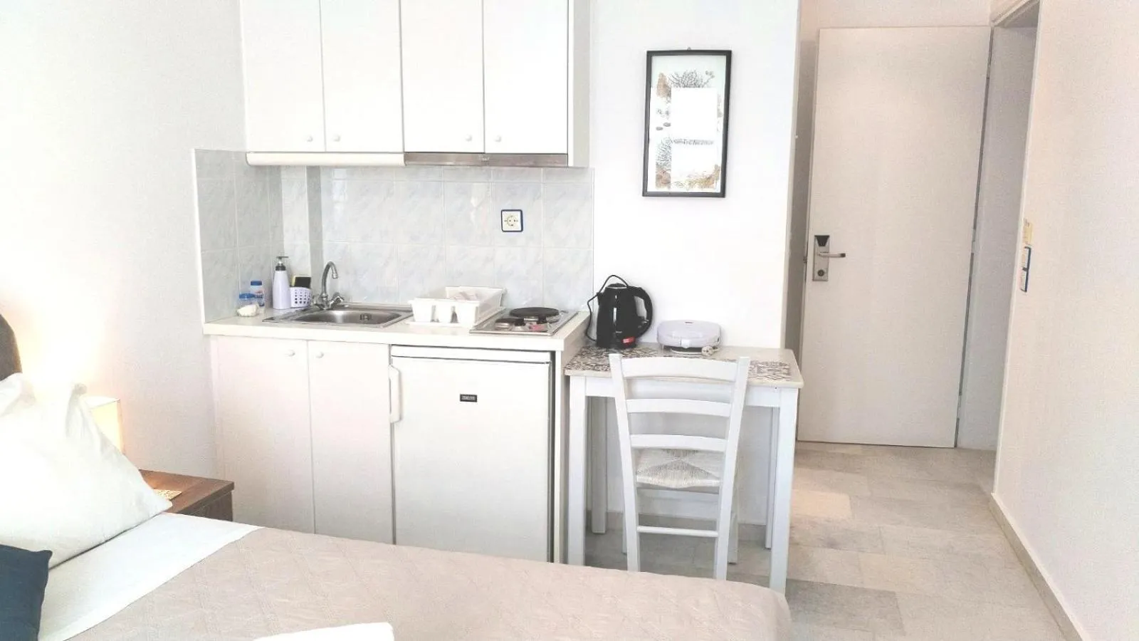 Kitchen or kitchenette in Nostos Studios at Saint George beach Agios Georgios Chora Naxos town