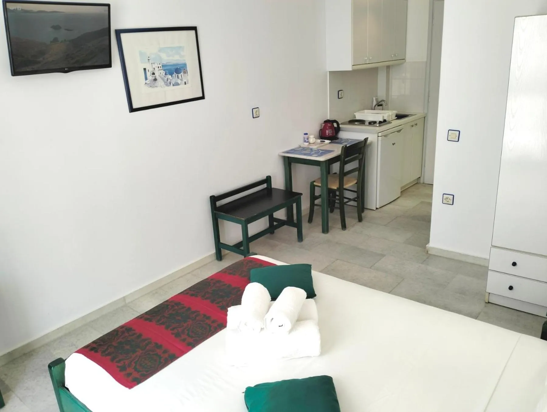 Kitchen or kitchenette in Nostos Studios at Saint George beach Agios Georgios Chora Naxos town