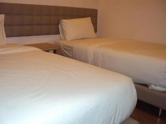 Bed in GM City Hotel