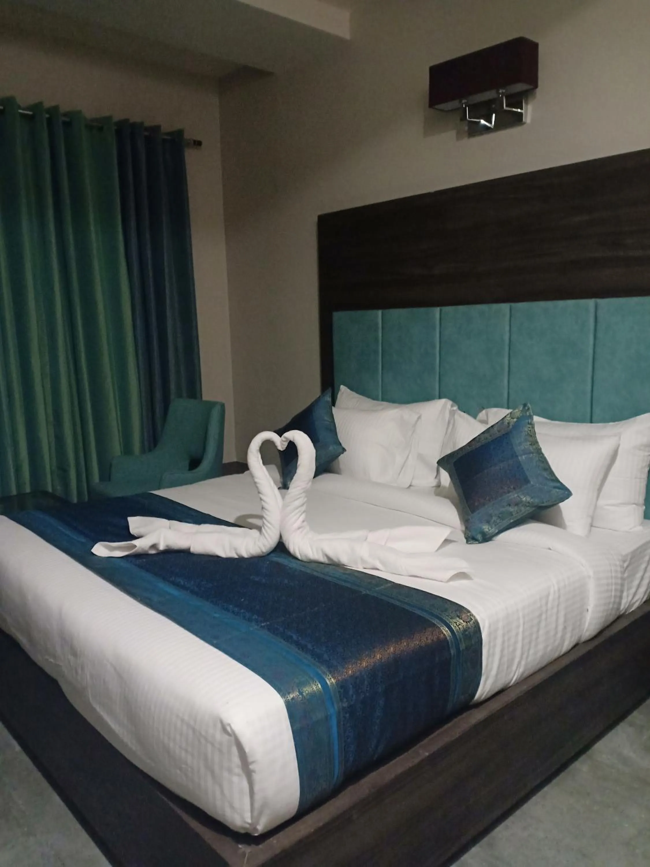 towels, Bed in Hotel Abhinav International