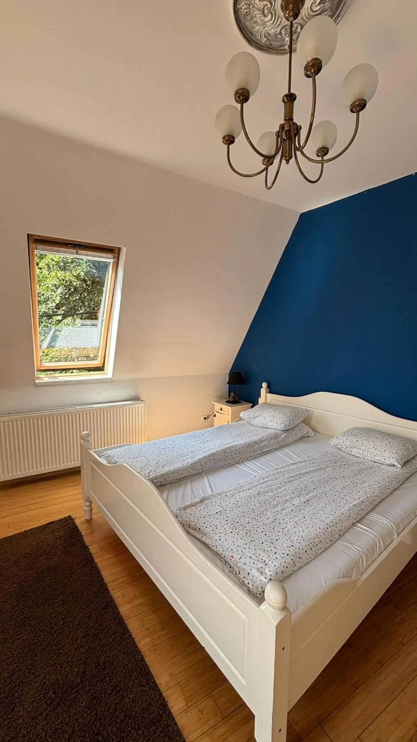 Bed in Pannónia Rooms and Apartments