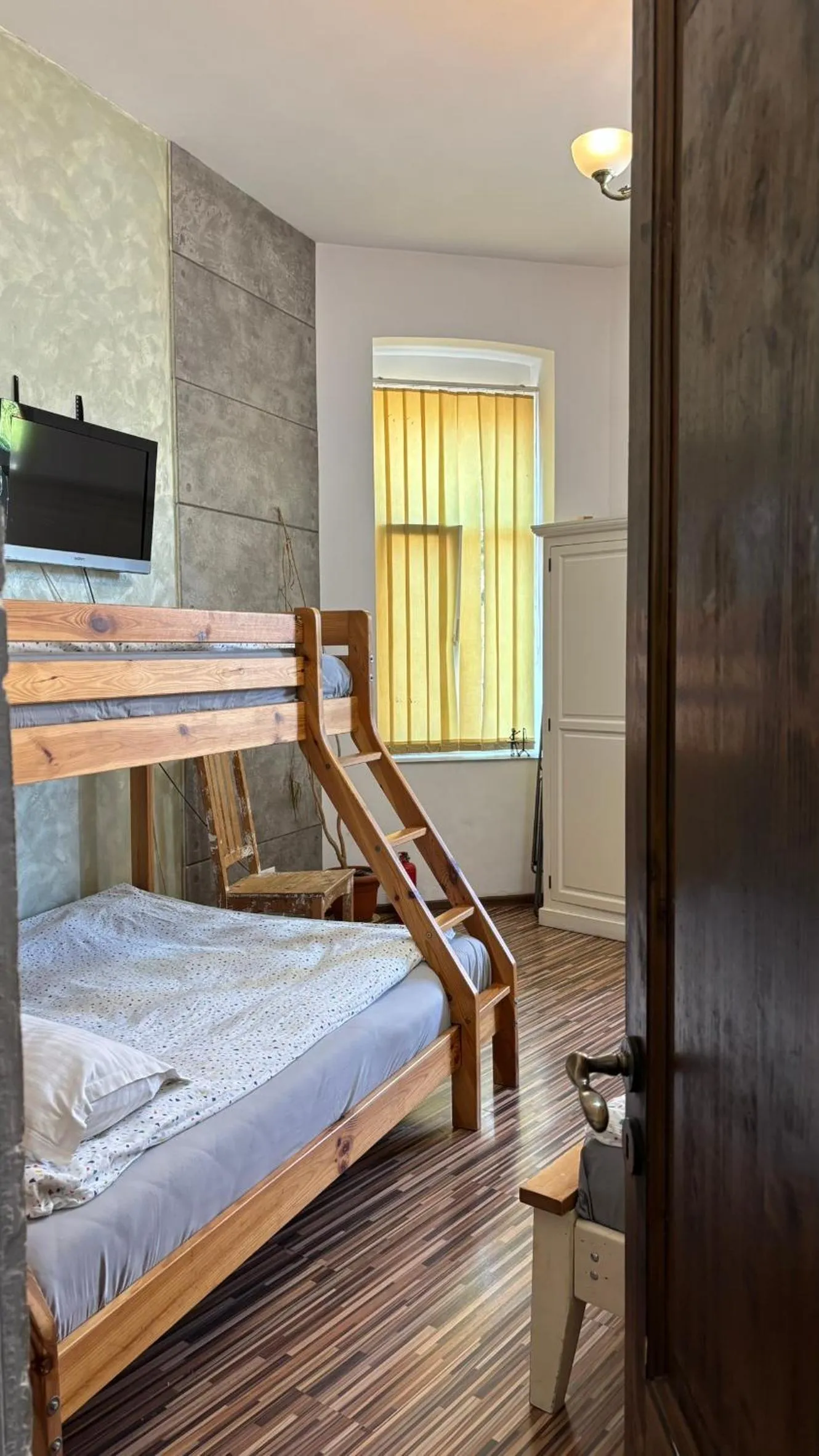 Bed in Pannónia Rooms and Apartments