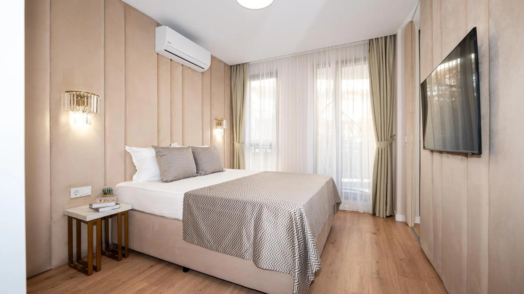 Bed in Harmony Suites Grand Resort