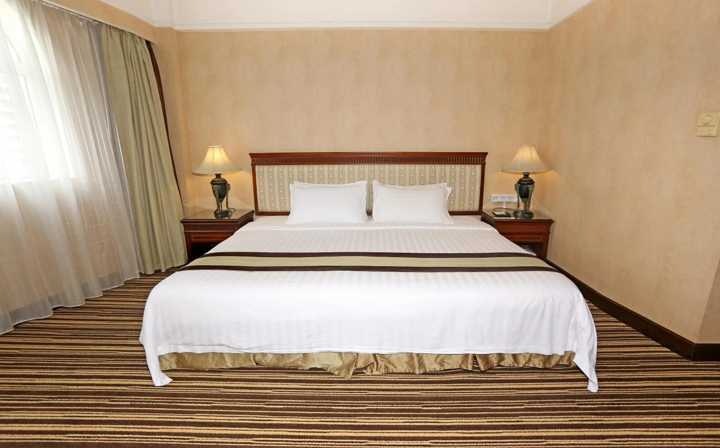 Bed in Grand Palace Hotel - Grand Hotel Management Group