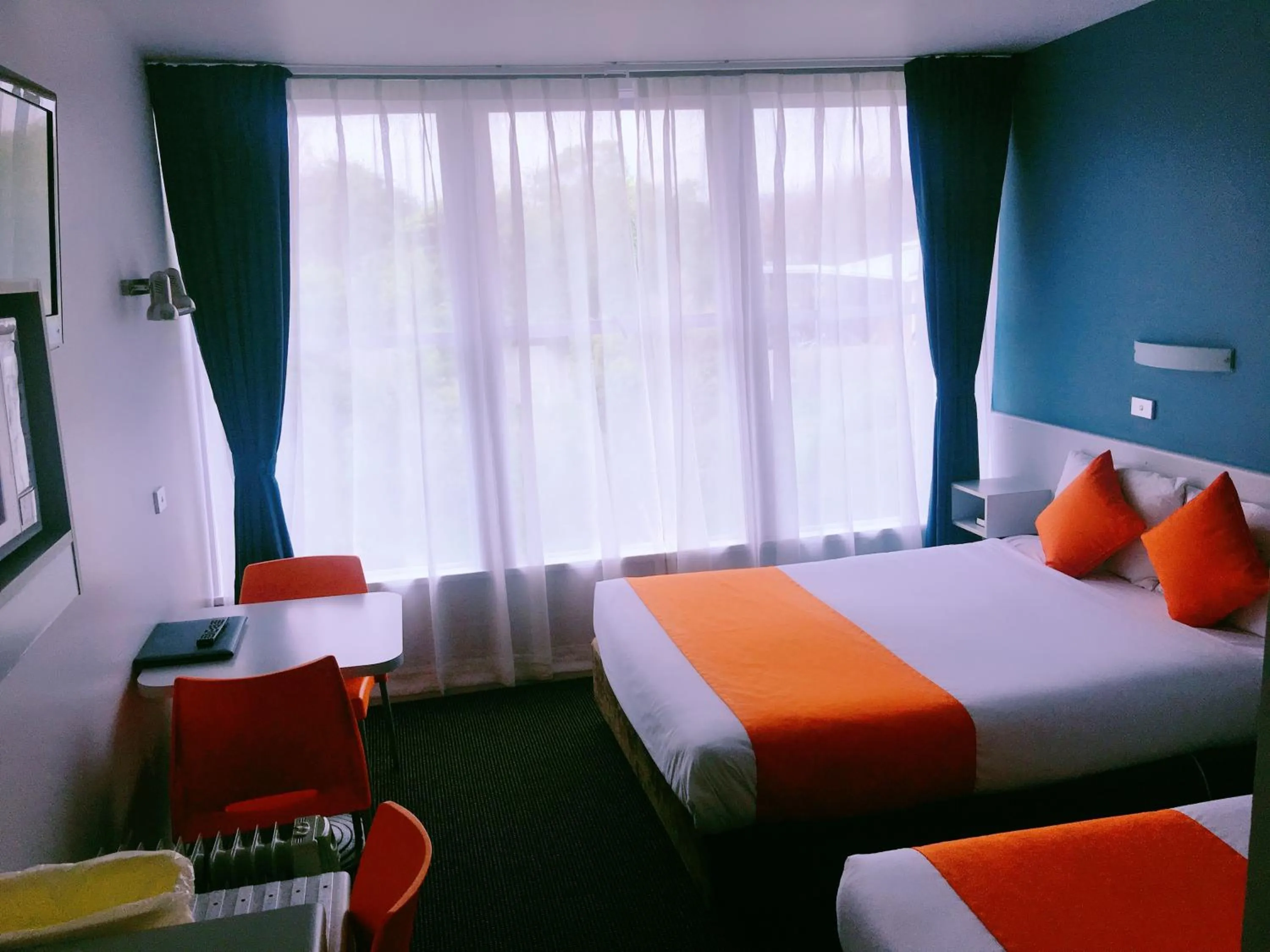 Bed in Waterfront Lodge Motel