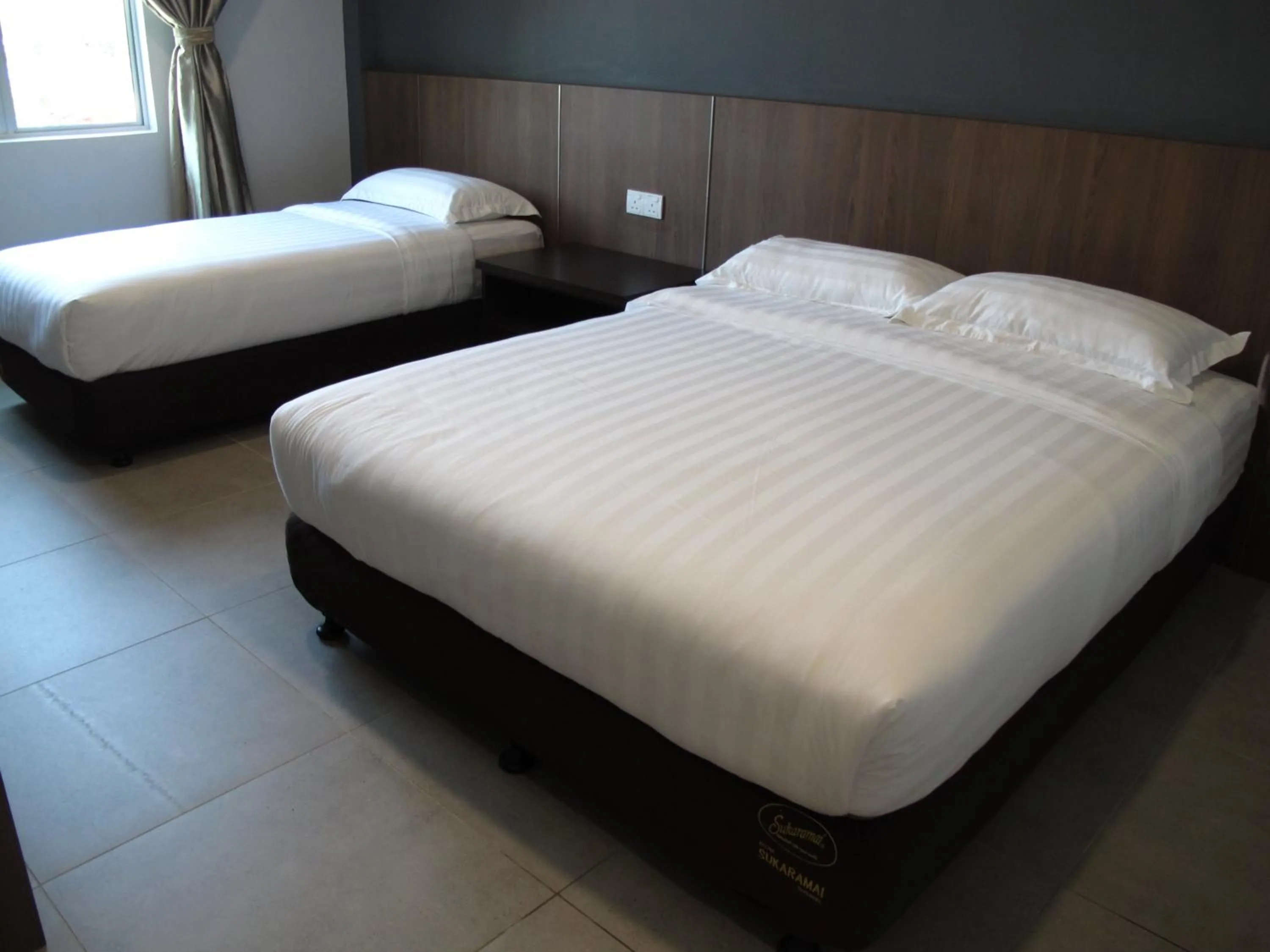Bed in HOTEL SUKARAMAI