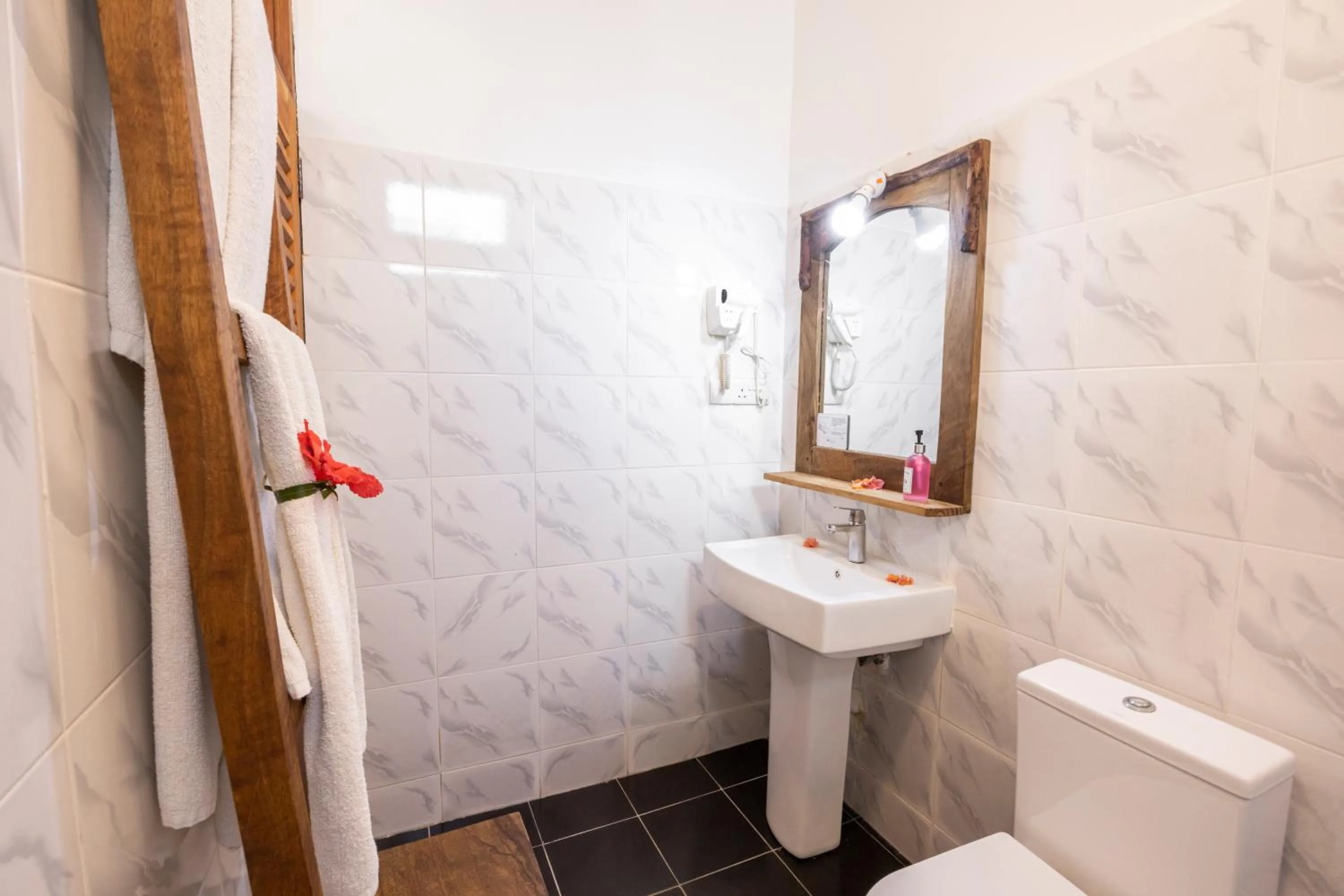 Bathroom in Paradise Beach Resort & Spa