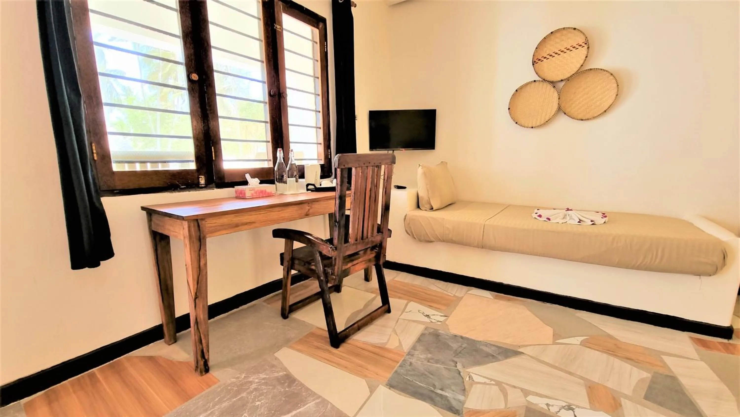 Seating area, Bed in Paradise Beach Resort & Spa