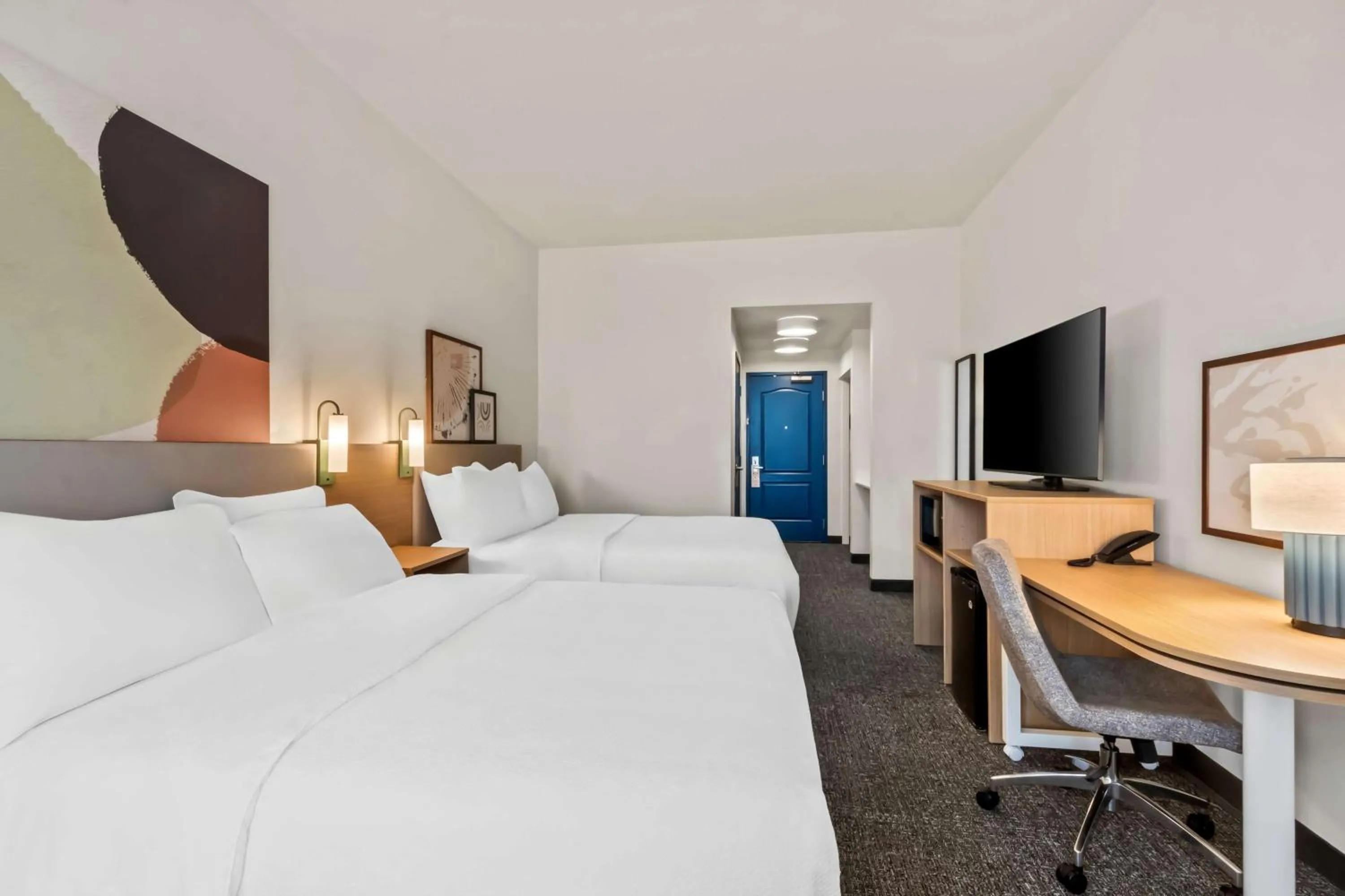 Bed in Legacy Inn & Suites