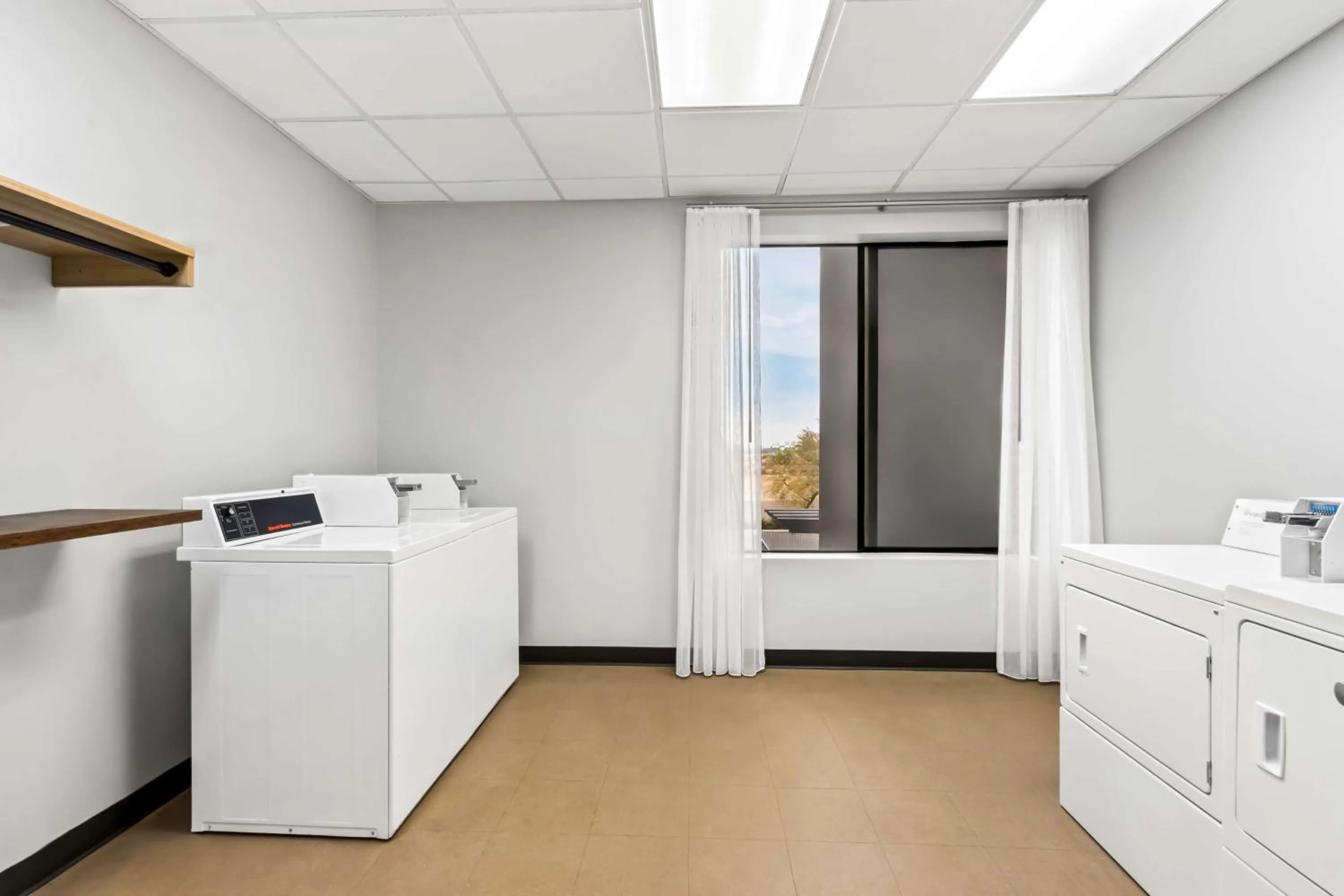 laundry in Legacy Inn & Suites