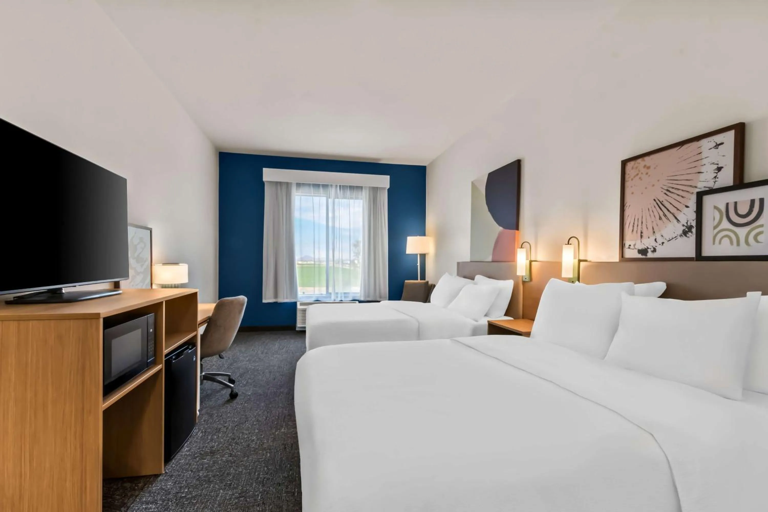 Bed in Legacy Inn & Suites