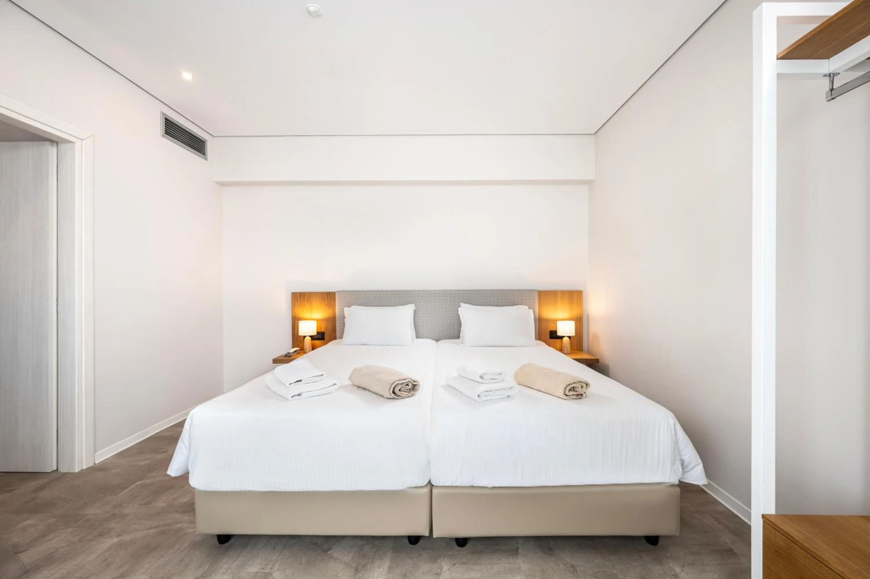 Bed in Athina Palace Resort & Spa