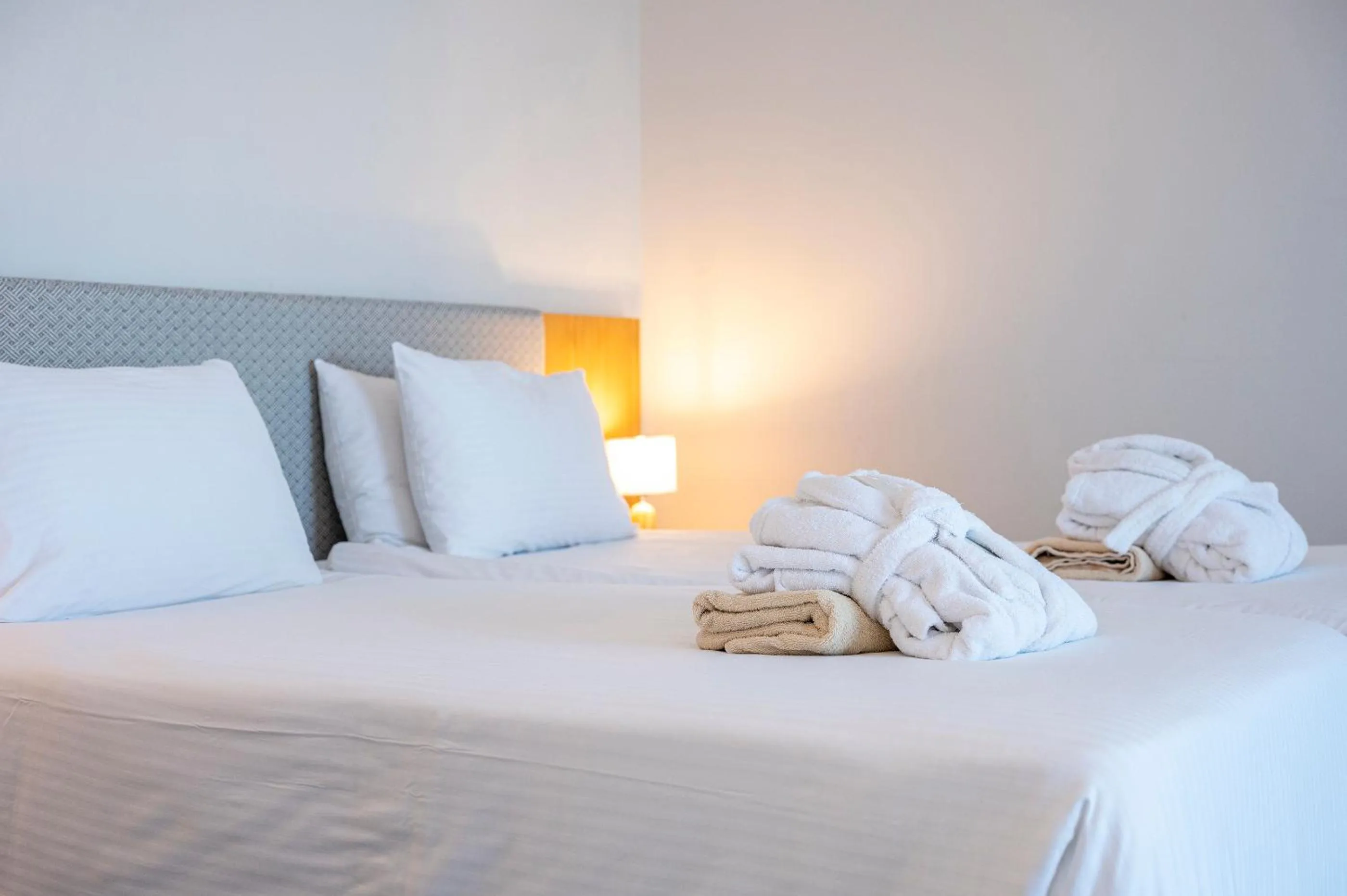 Bed in Athina Palace Resort & Spa