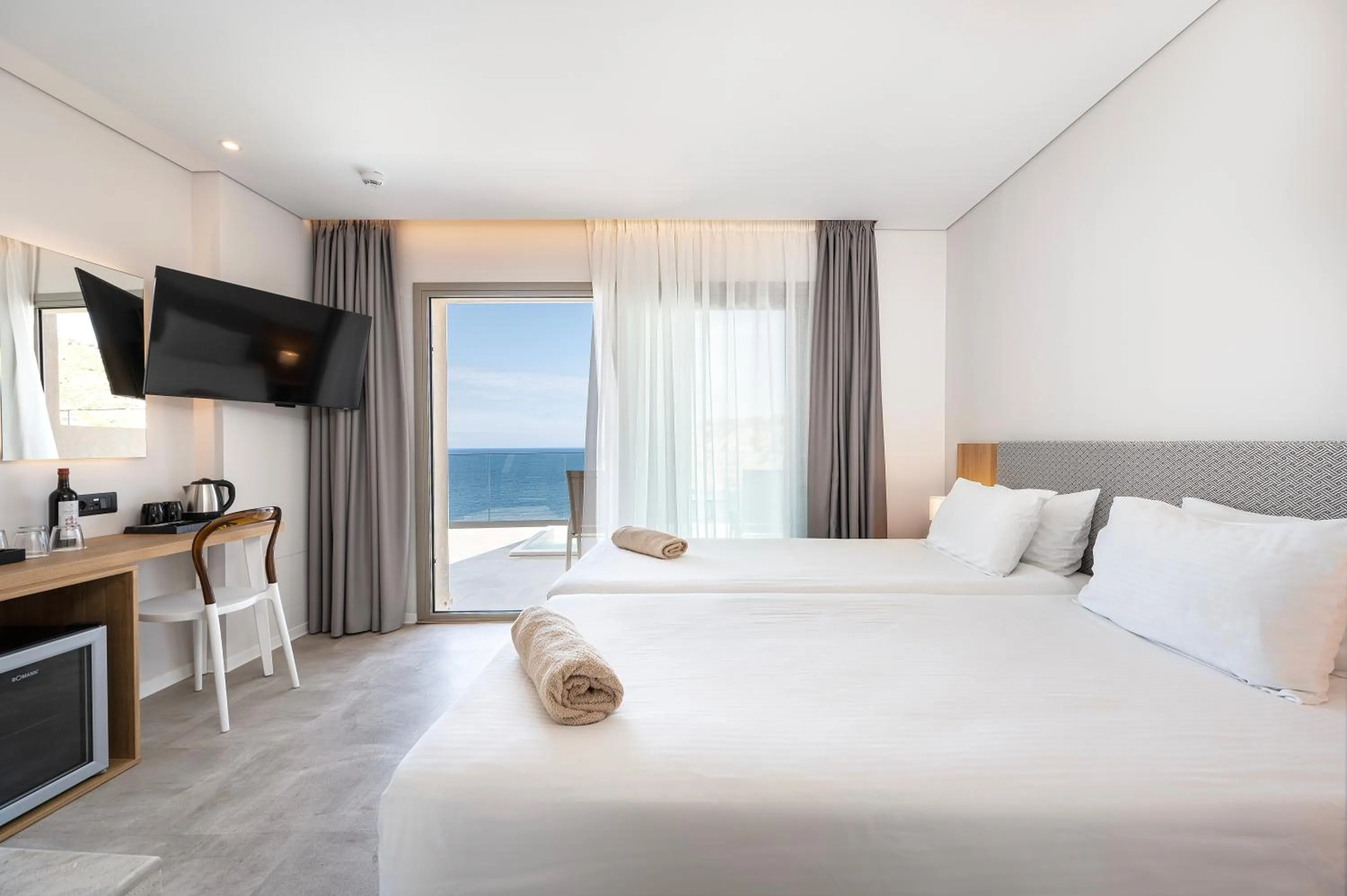 Bed in Athina Palace Resort & Spa