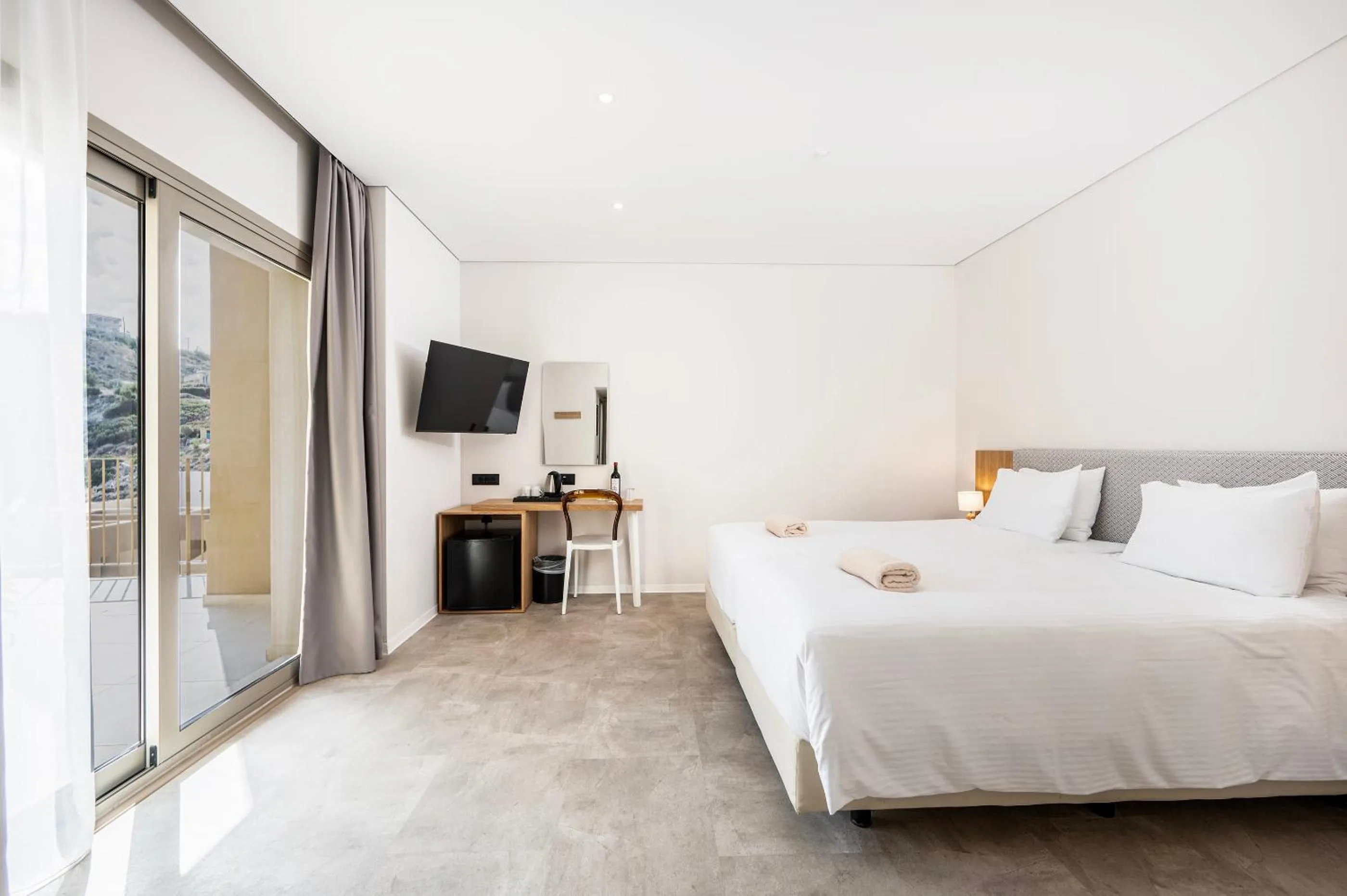 Bed in Athina Palace Resort & Spa