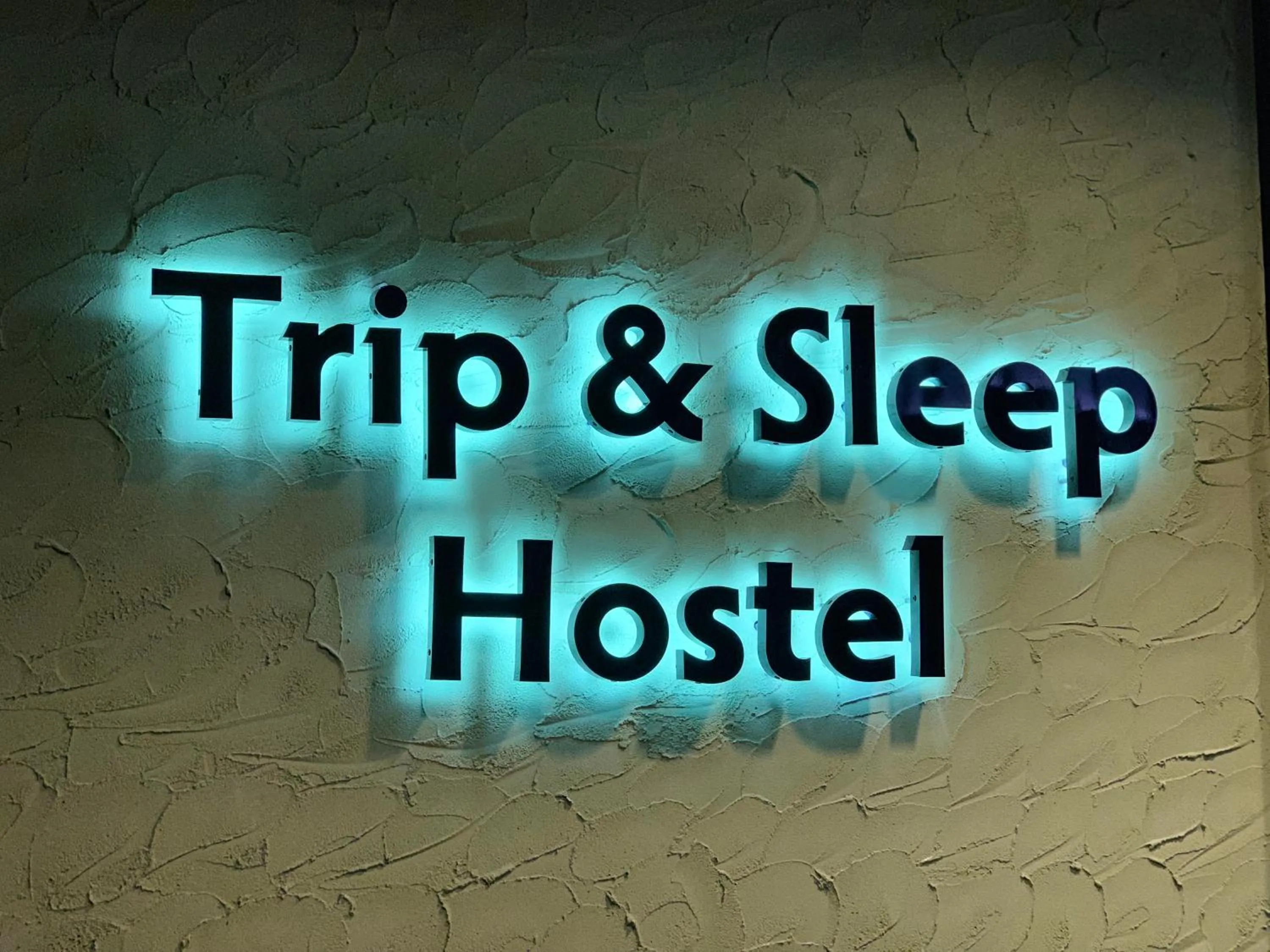 Property logo or sign in Trip & Sleep Hostel