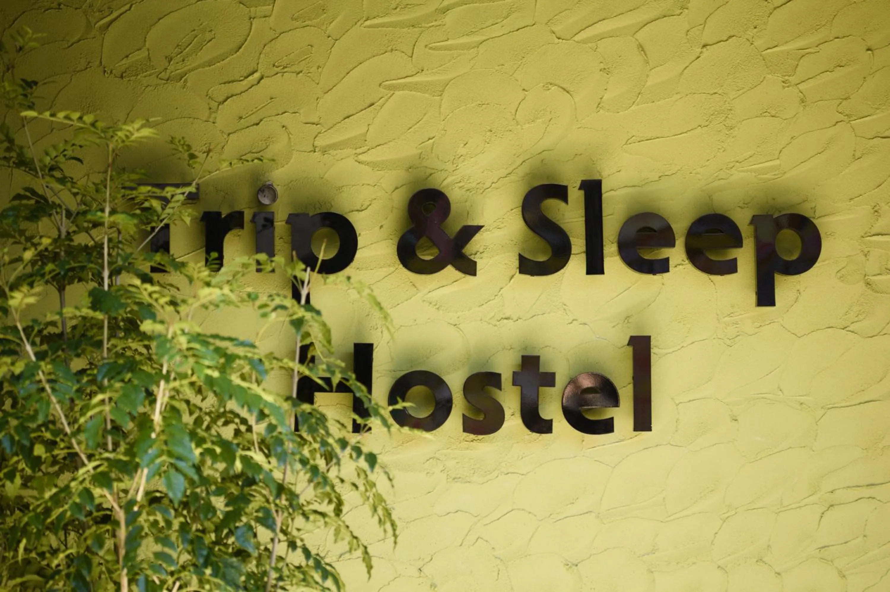 Property logo or sign in Trip & Sleep Hostel