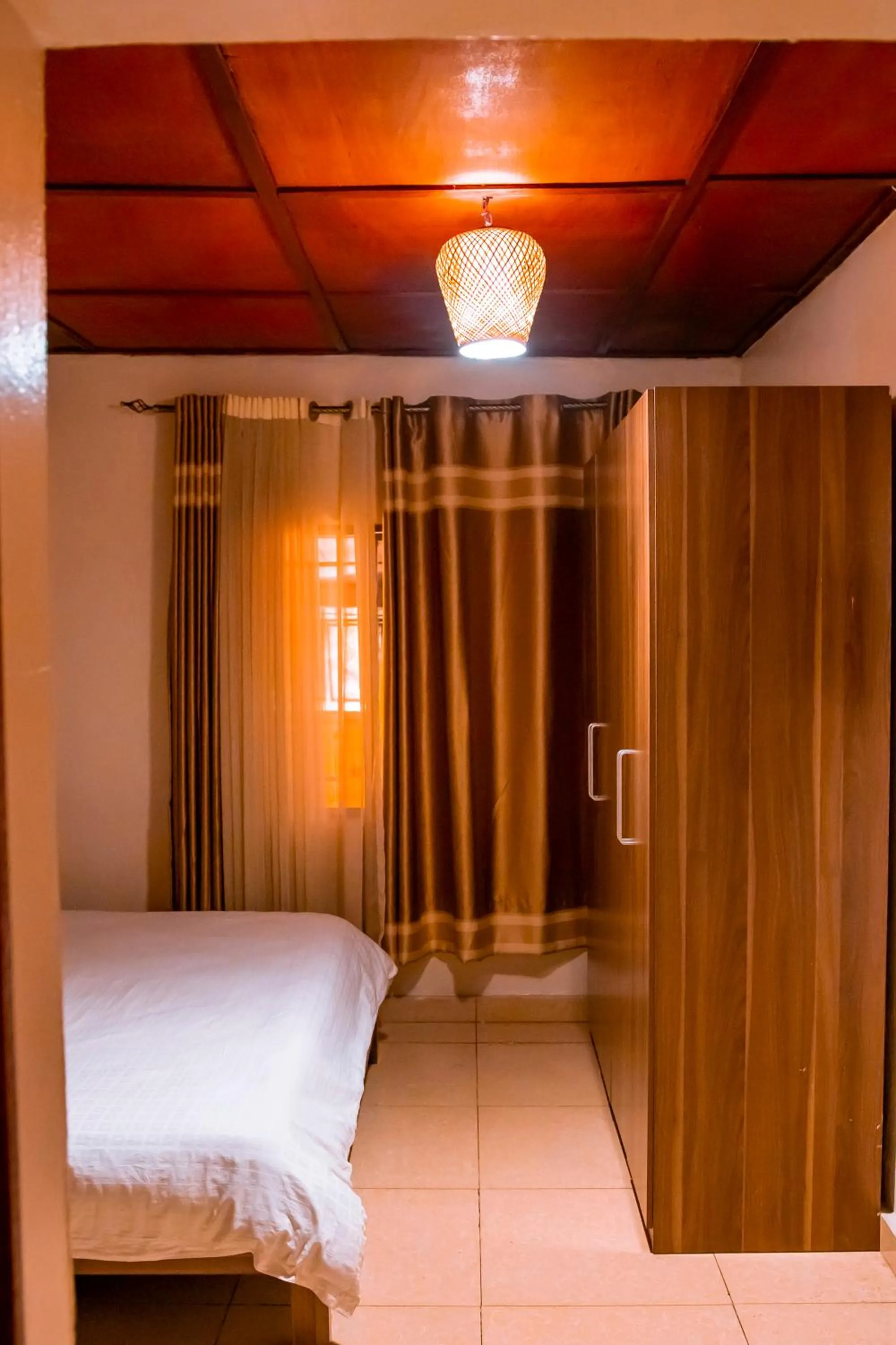 wardrobe, Bed in B.Maurice Guest House