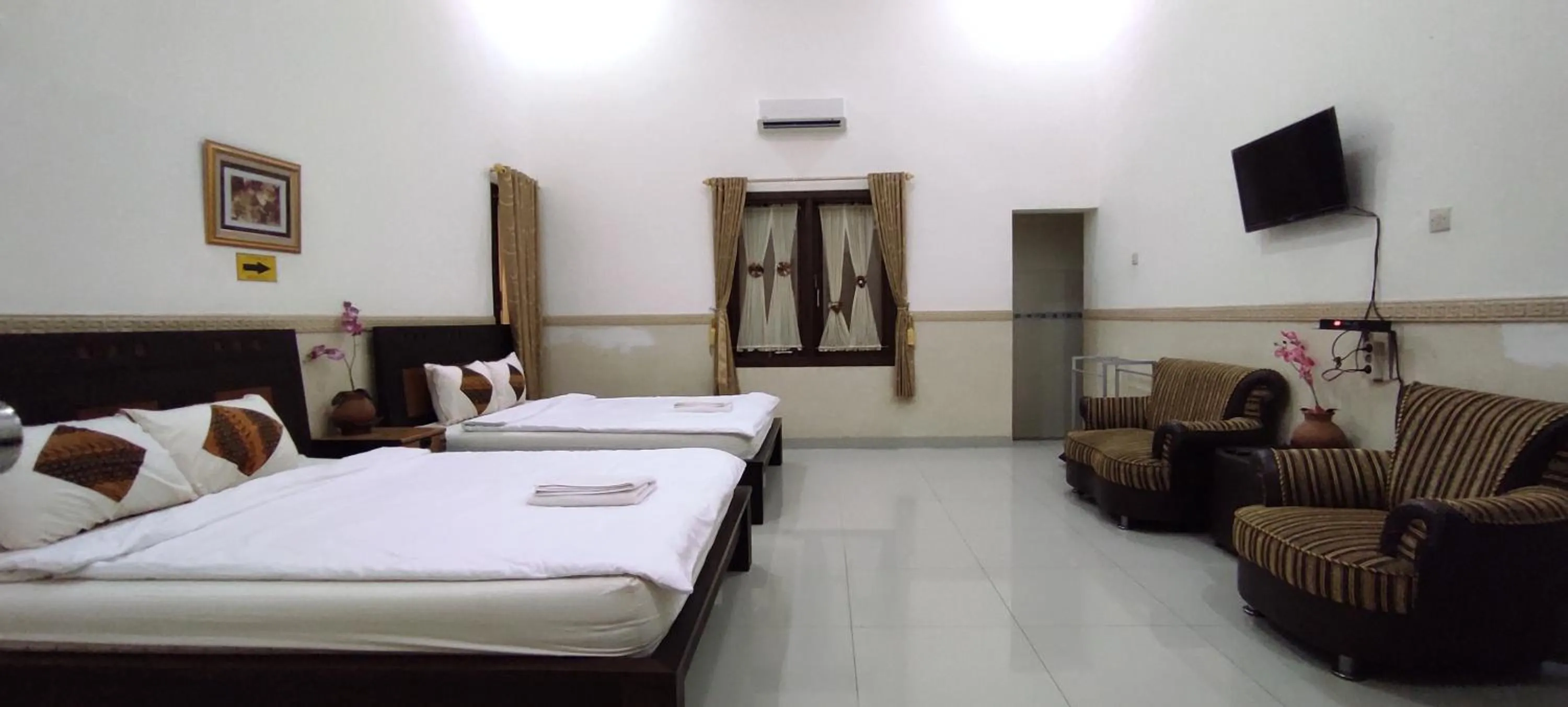 Bed in Ndalem Katong Guest House Ponorogo