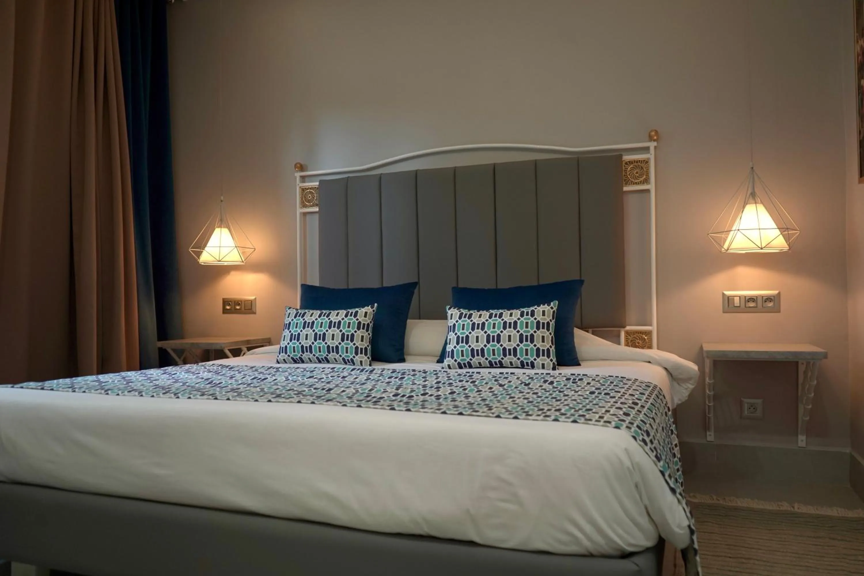 Bedroom in Suites Hôtel Les Charmilles & Spa