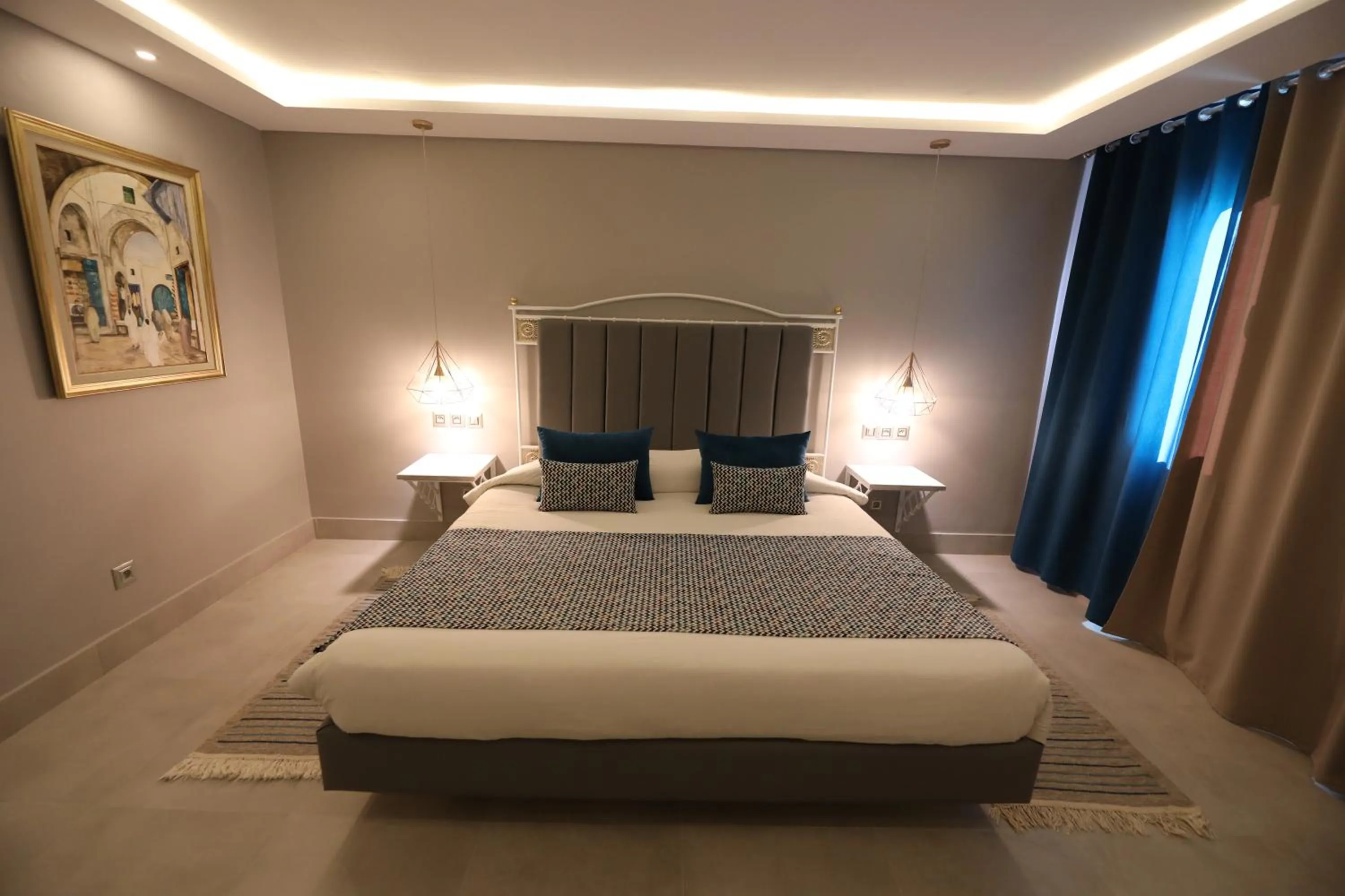 Bedroom in Suites Hôtel Les Charmilles & Spa