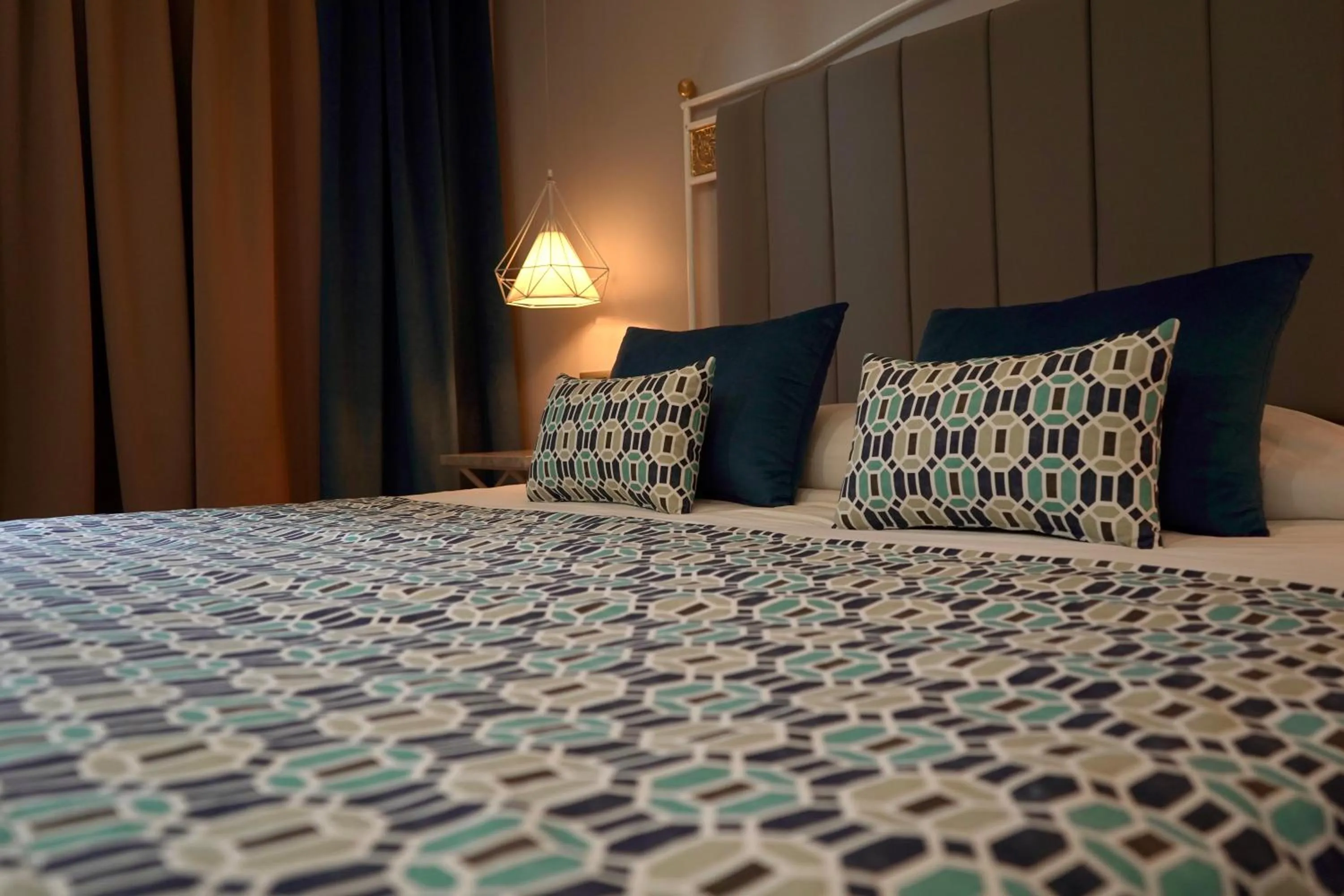 Bedroom in Suites Hôtel Les Charmilles & Spa