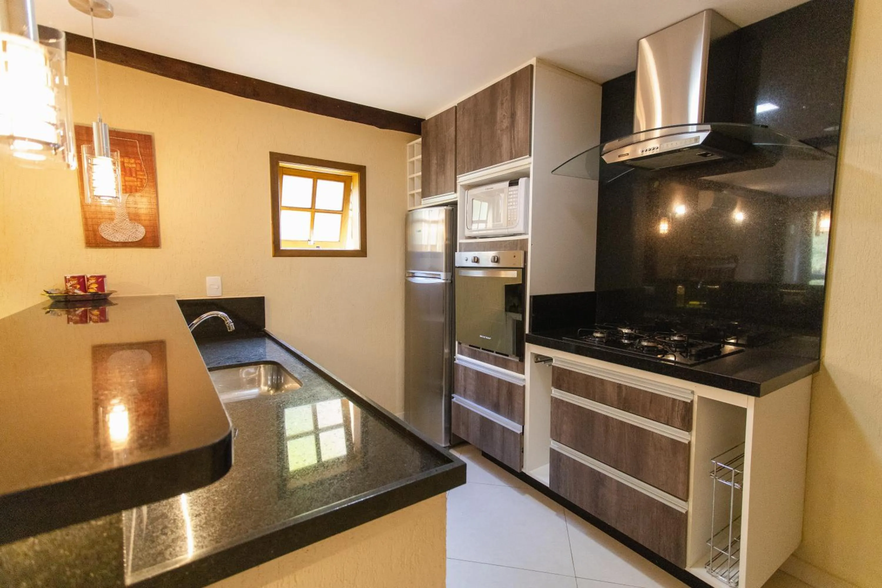 Kitchen or kitchenette in Pousada Cantagalo