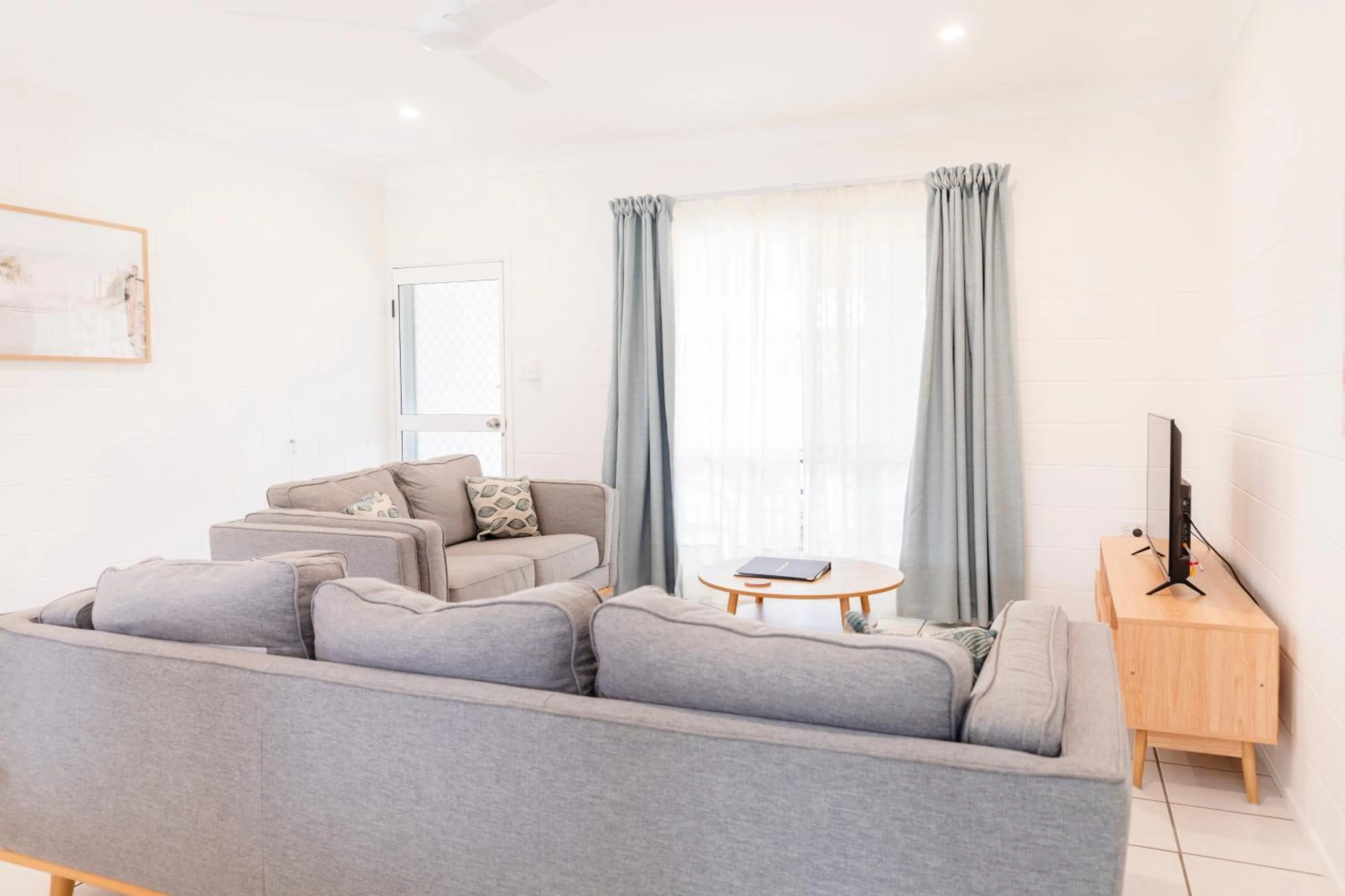 Living room in Palm View Holiday Apartments