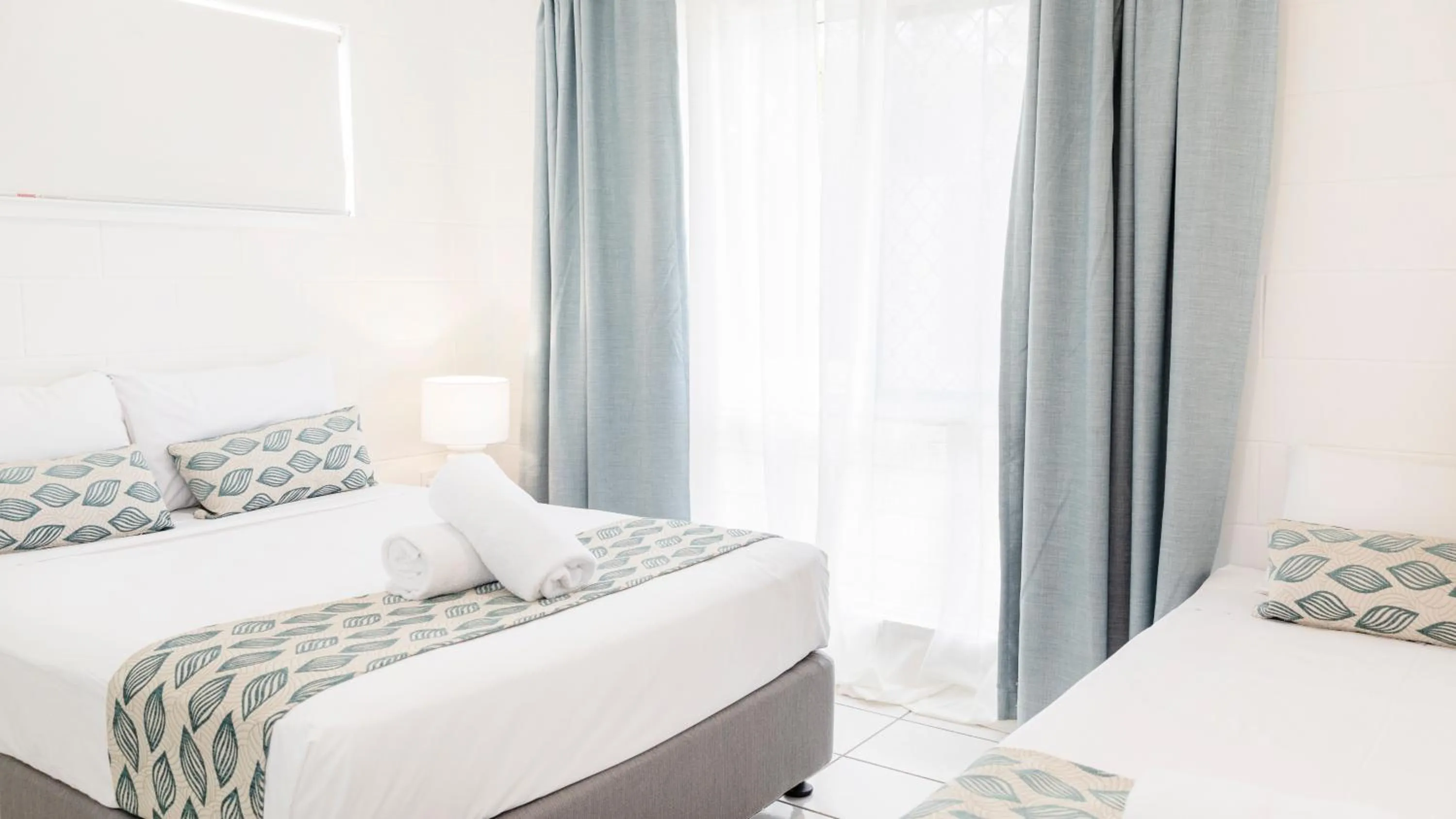 Bed in Palm View Holiday Apartments