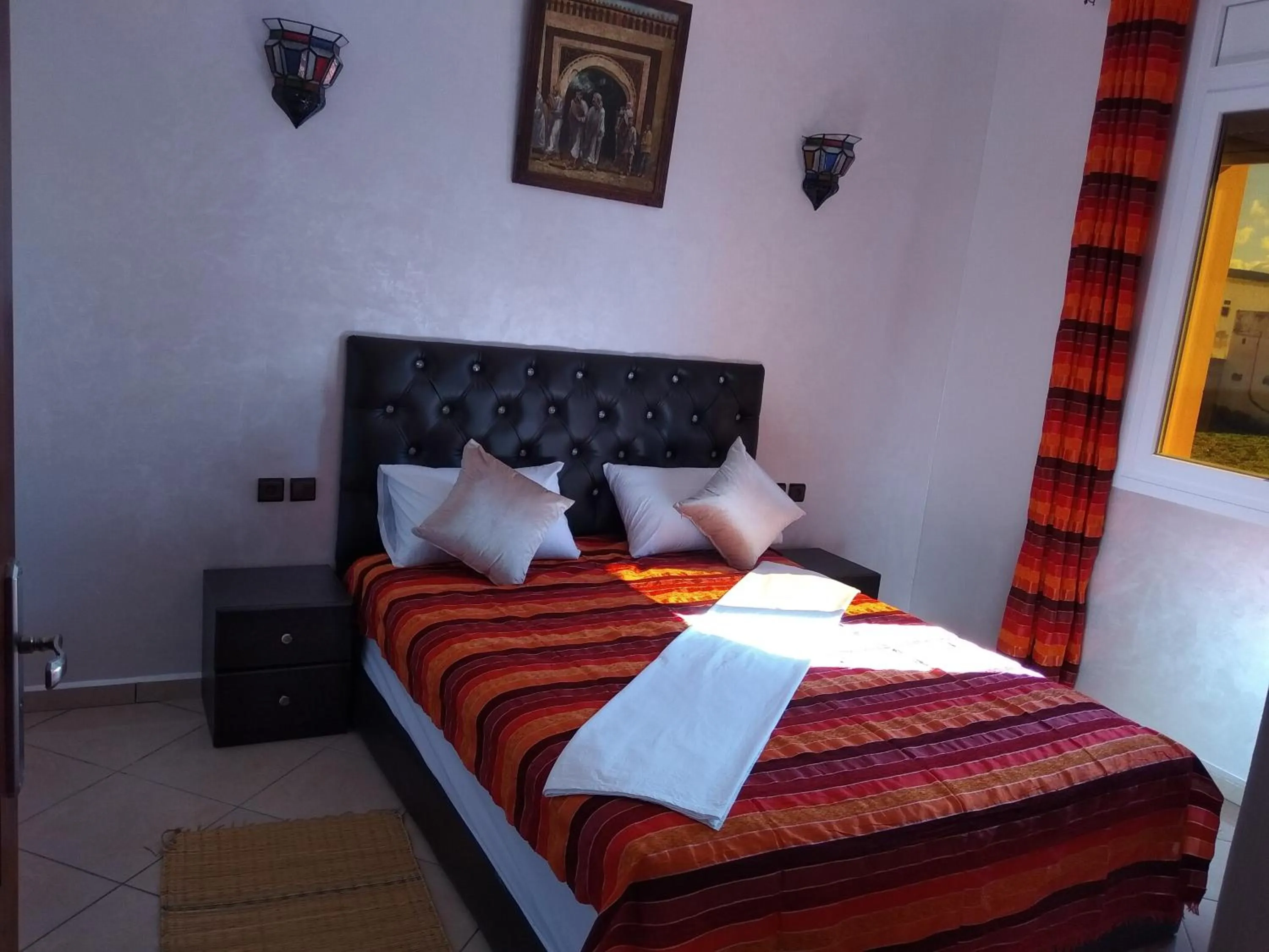 Bed in ITRANE GUEST HOUSE