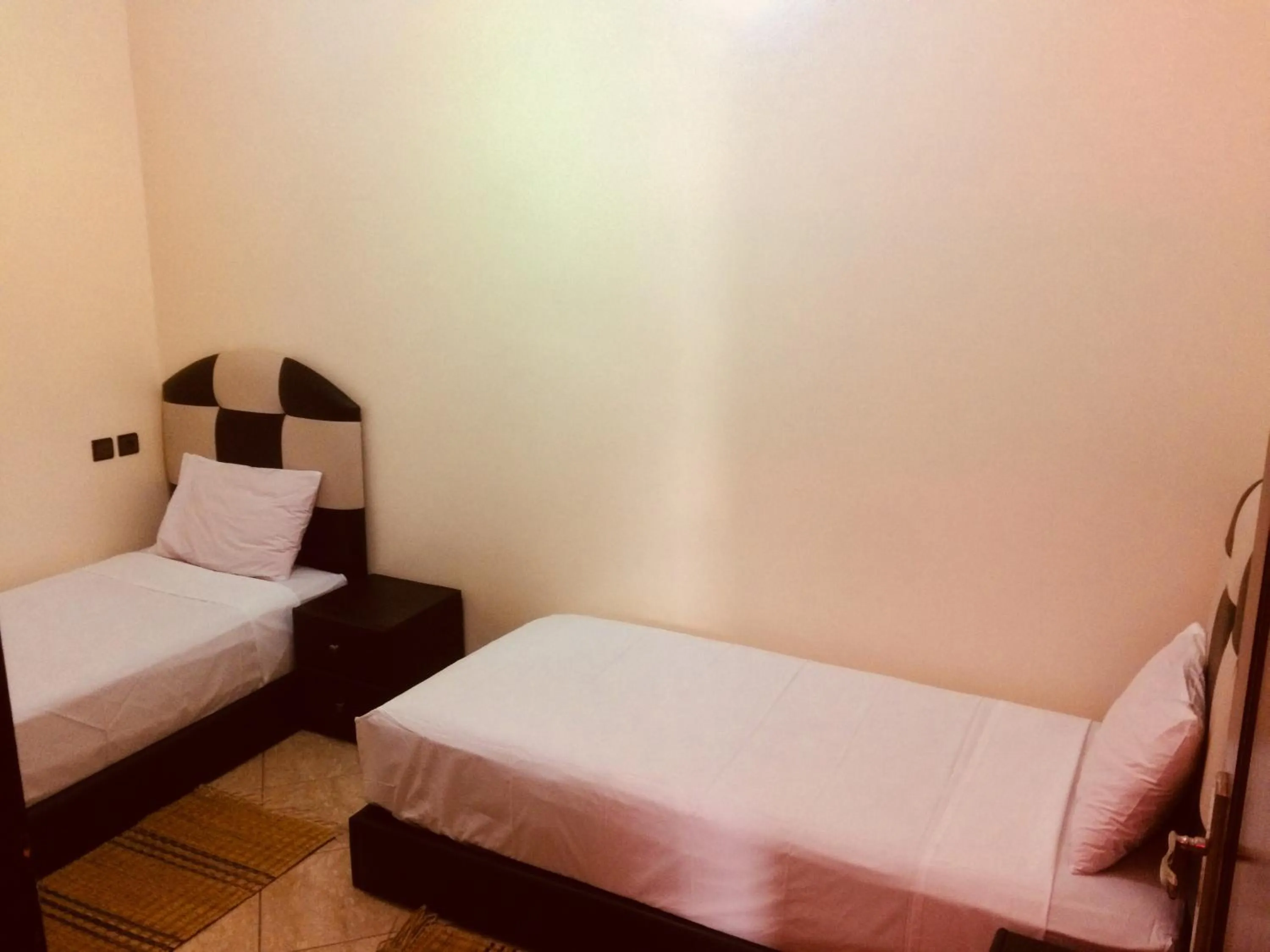 Bed in ITRANE GUEST HOUSE