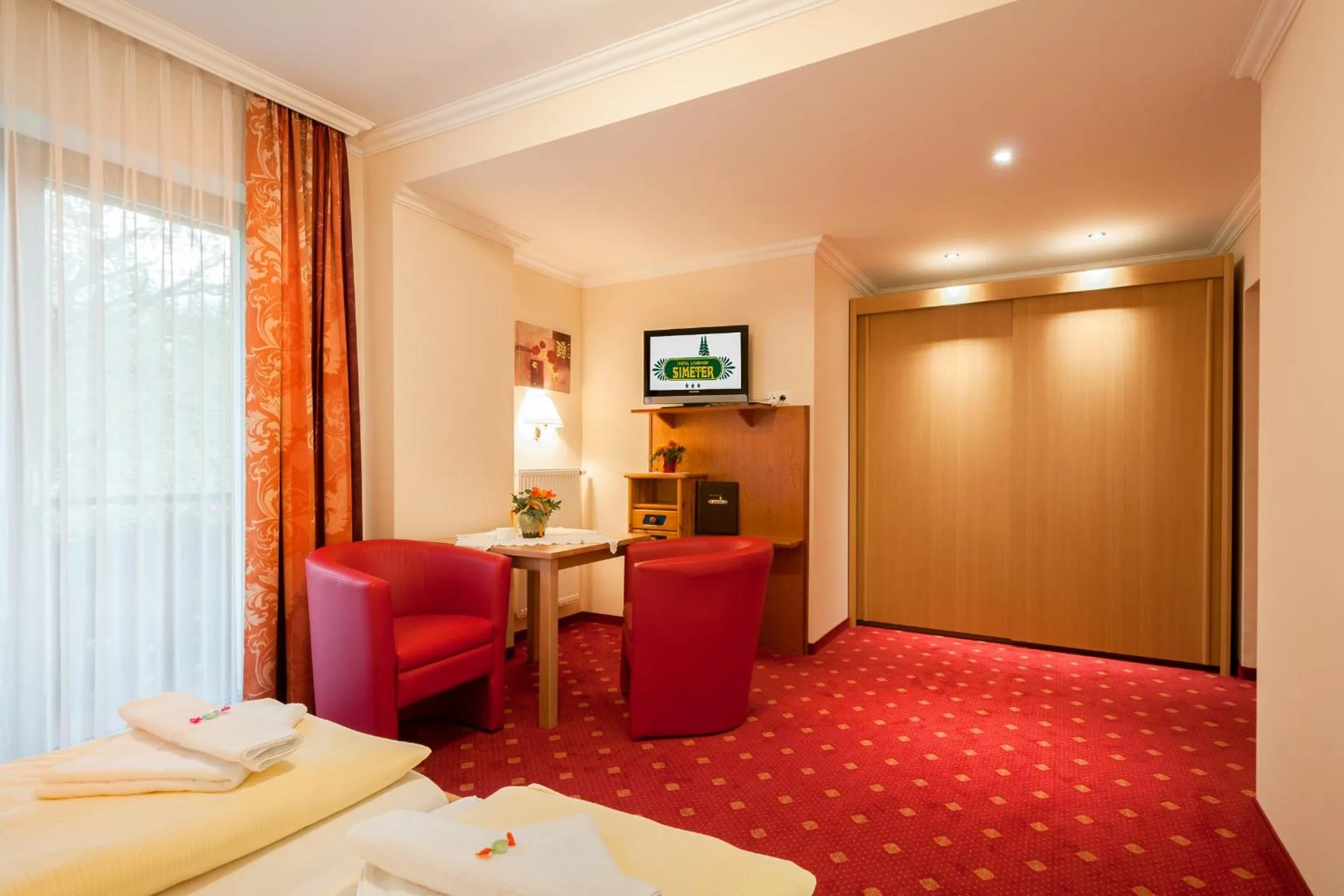 Photo of the whole room, Bed in Hotel Landhof Simeter GMBH