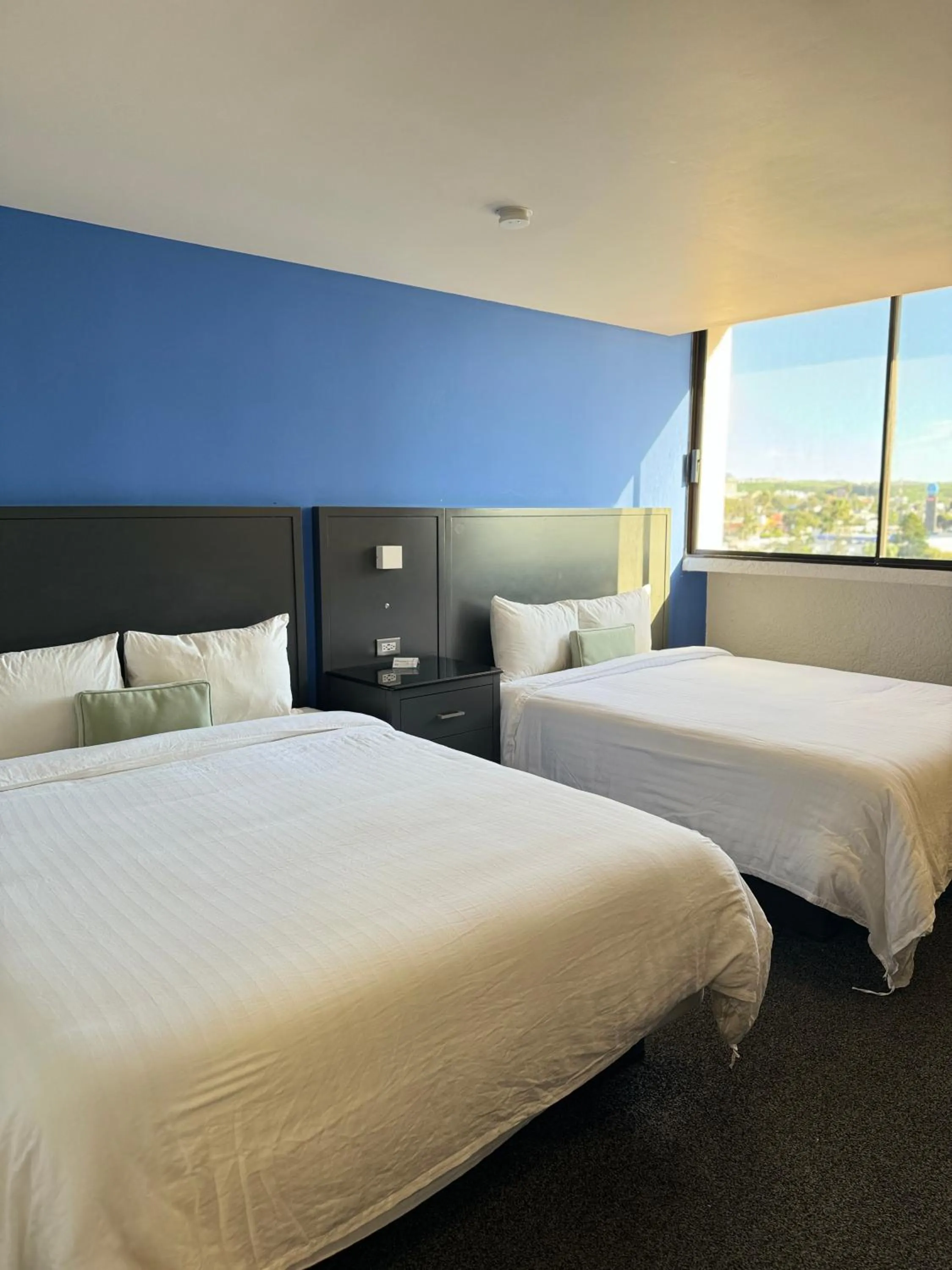 Bed in Hotel Corona Plaza