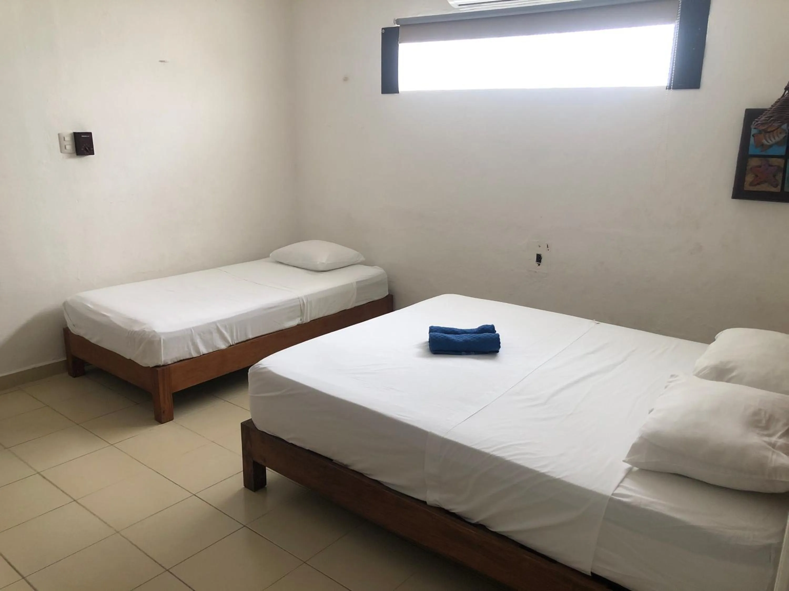 Photo of the whole room, Bed in Caribo Cozumel