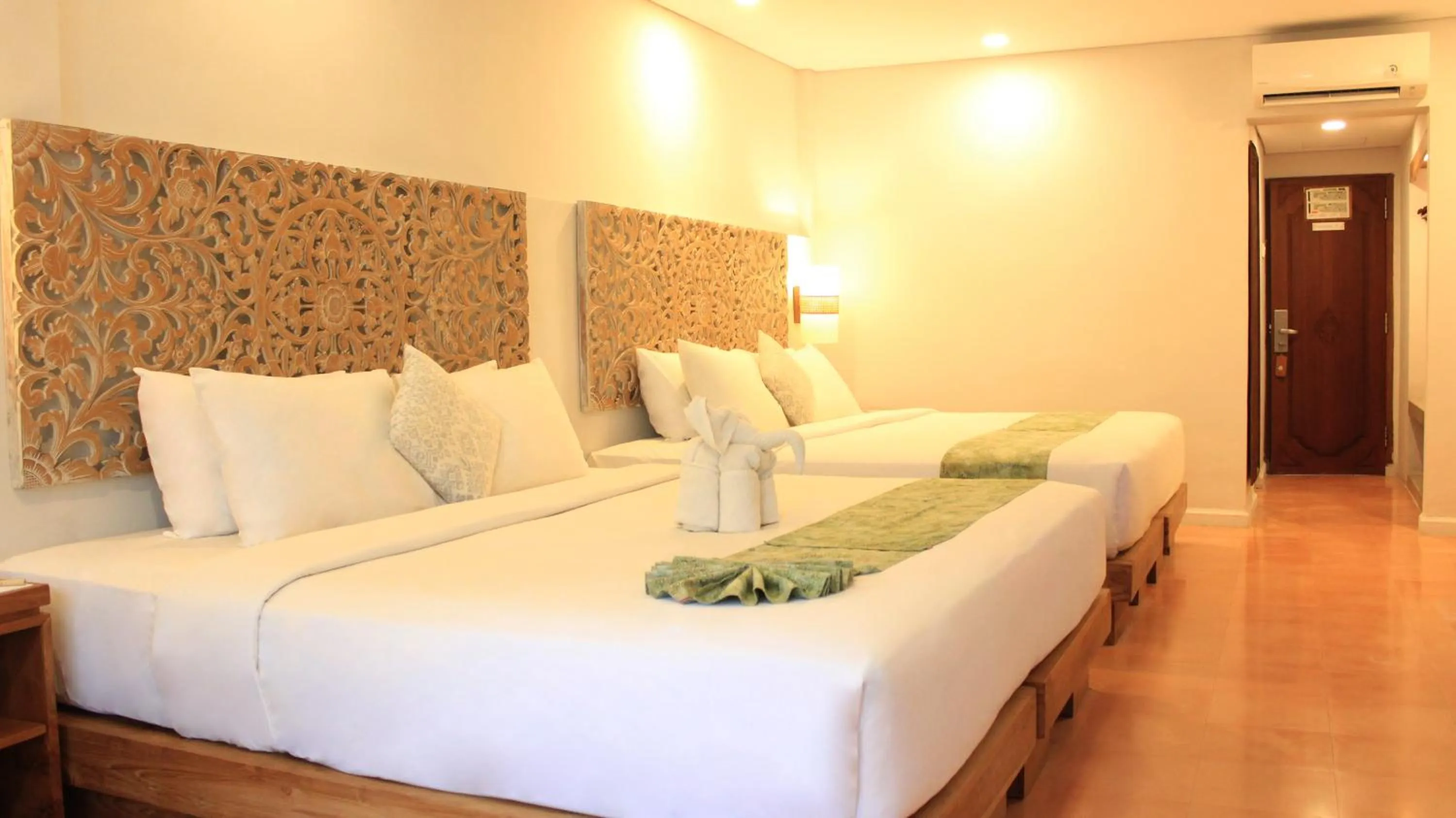 Bed in AlamKulkul Boutique Resort