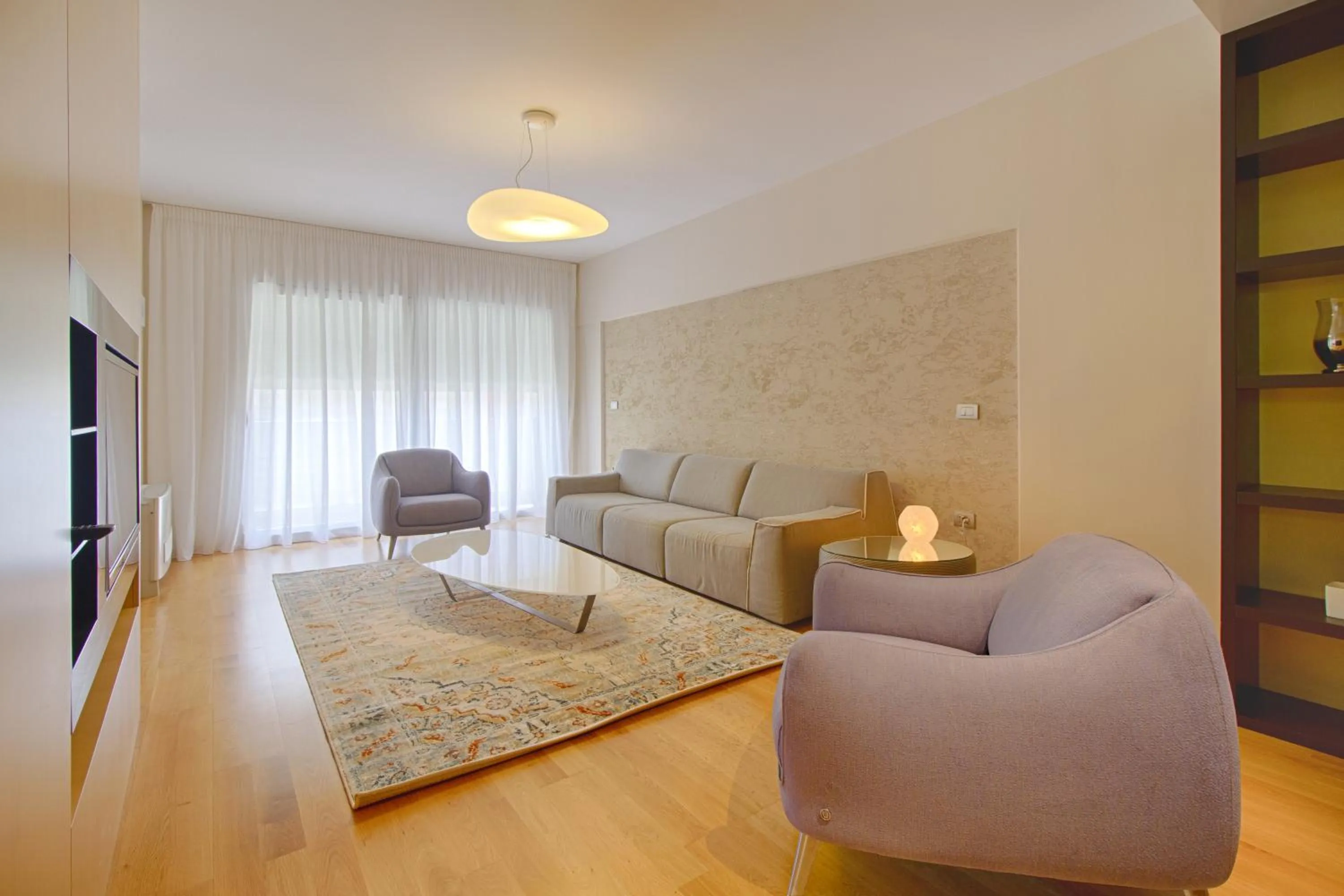 Communal lounge/ TV room in The Rooms Serviced Apartments Tirana