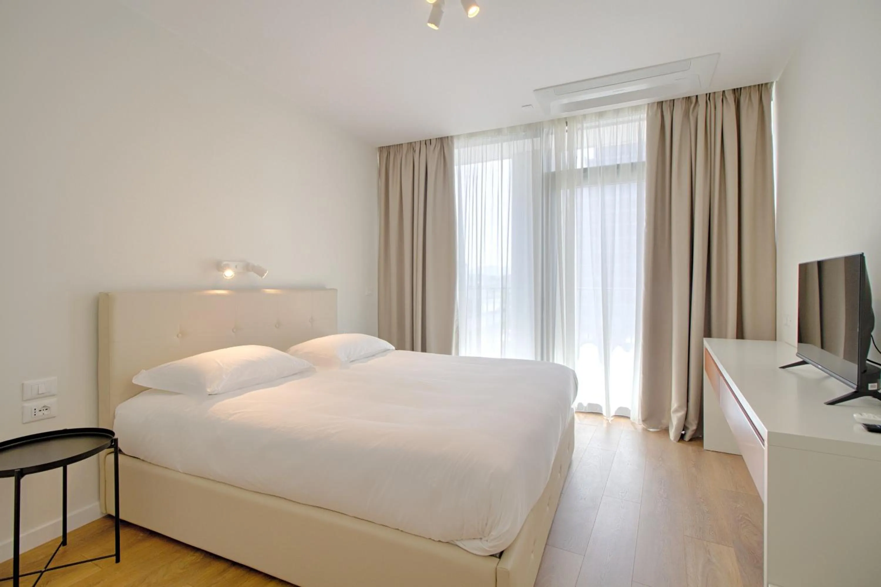 TV and multimedia, Bed in The Rooms Serviced Apartments Tirana
