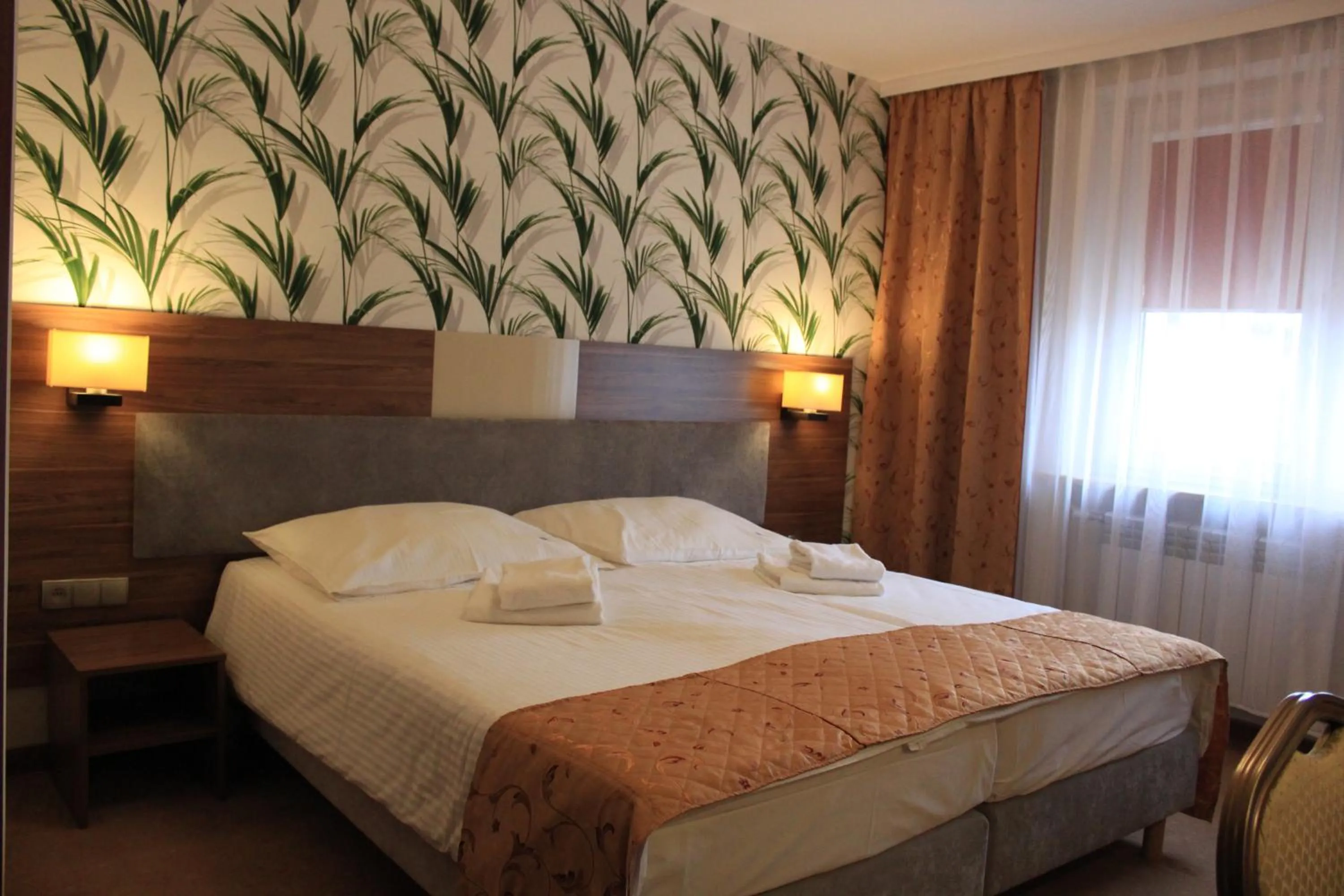 Bed in Cumulus Hotel