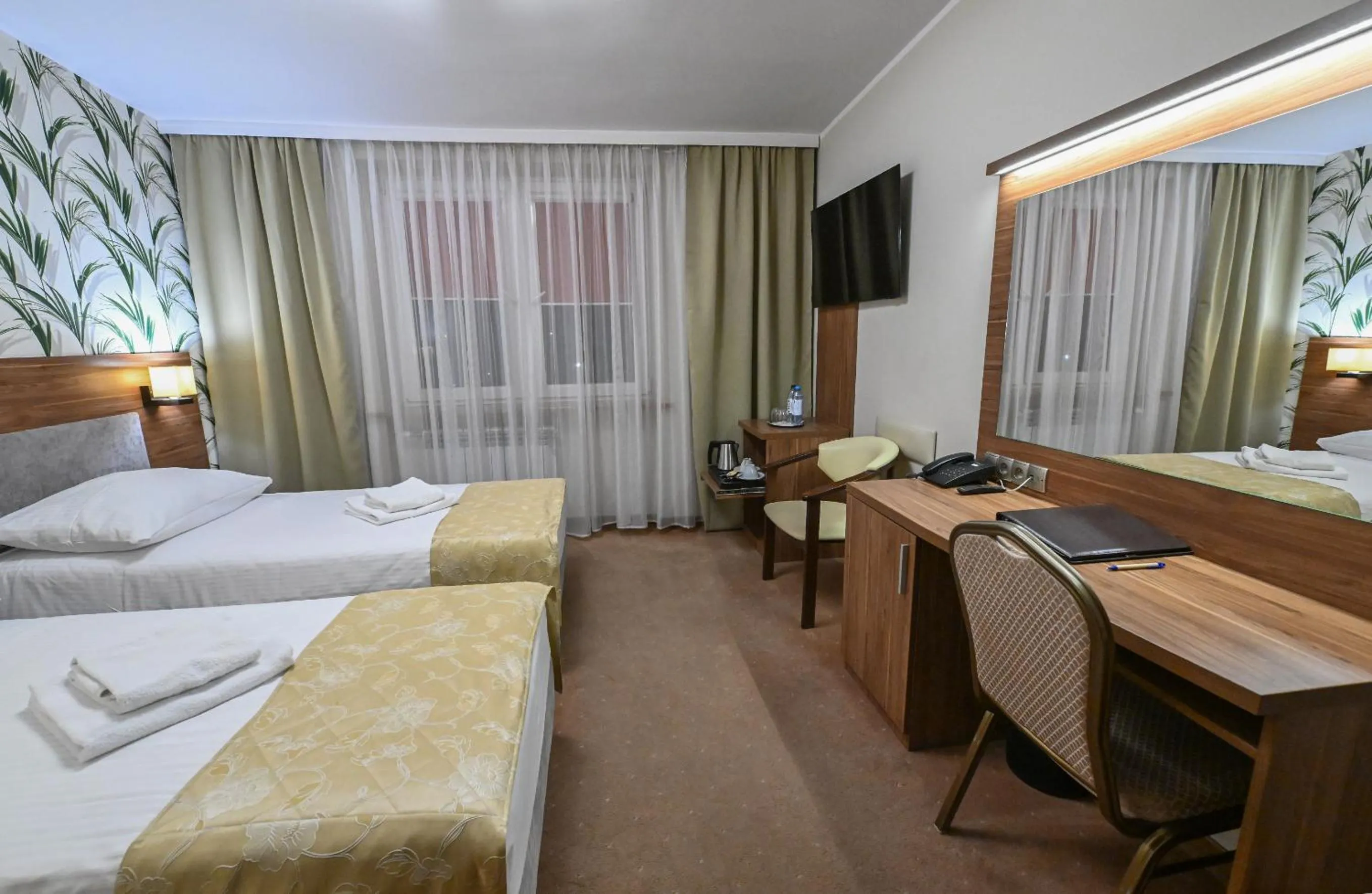 Bed in Cumulus Hotel