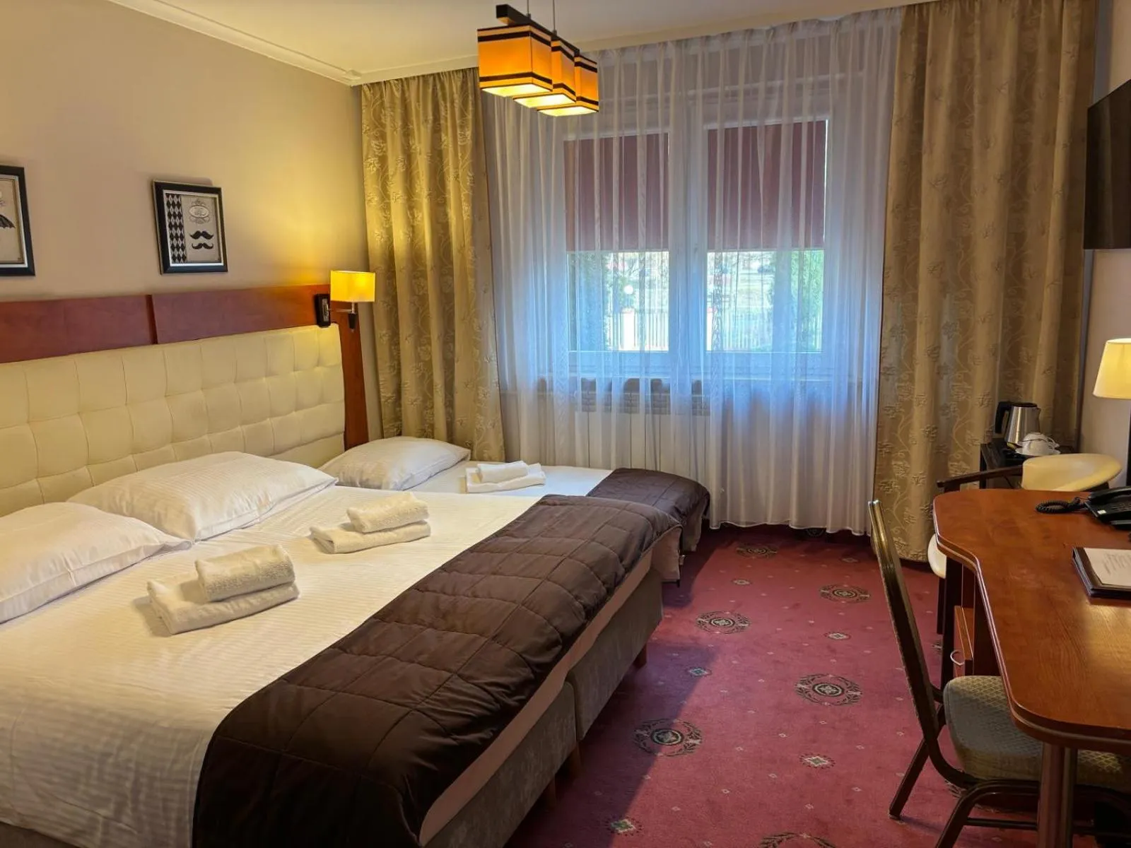 Bed in Cumulus Hotel