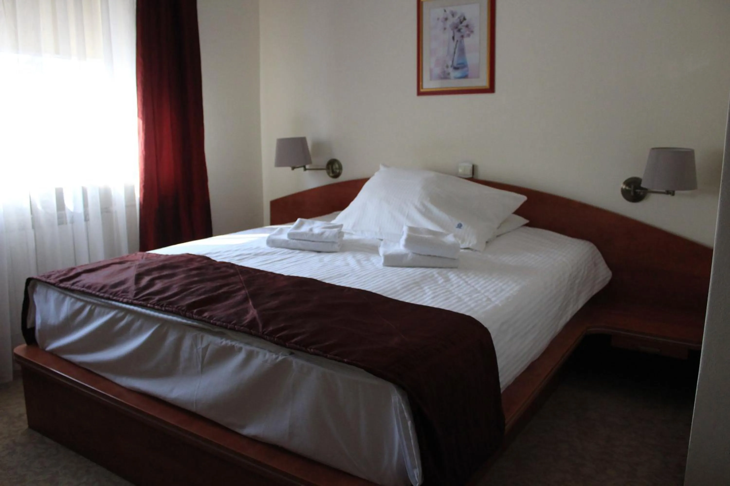 Bed in Cumulus Hotel