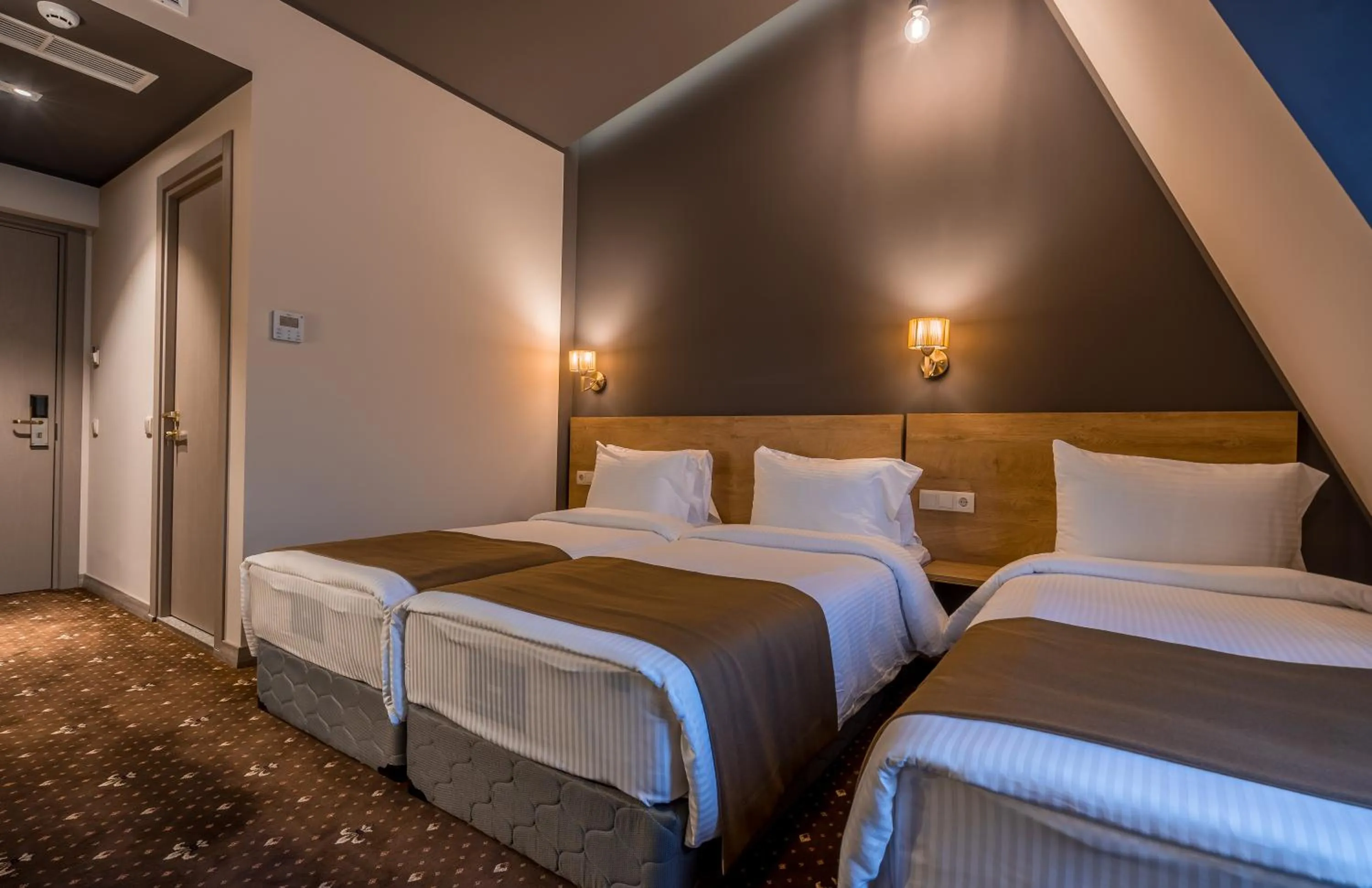 Bed in Gladius Inn Boutique Hotel by DNT Group