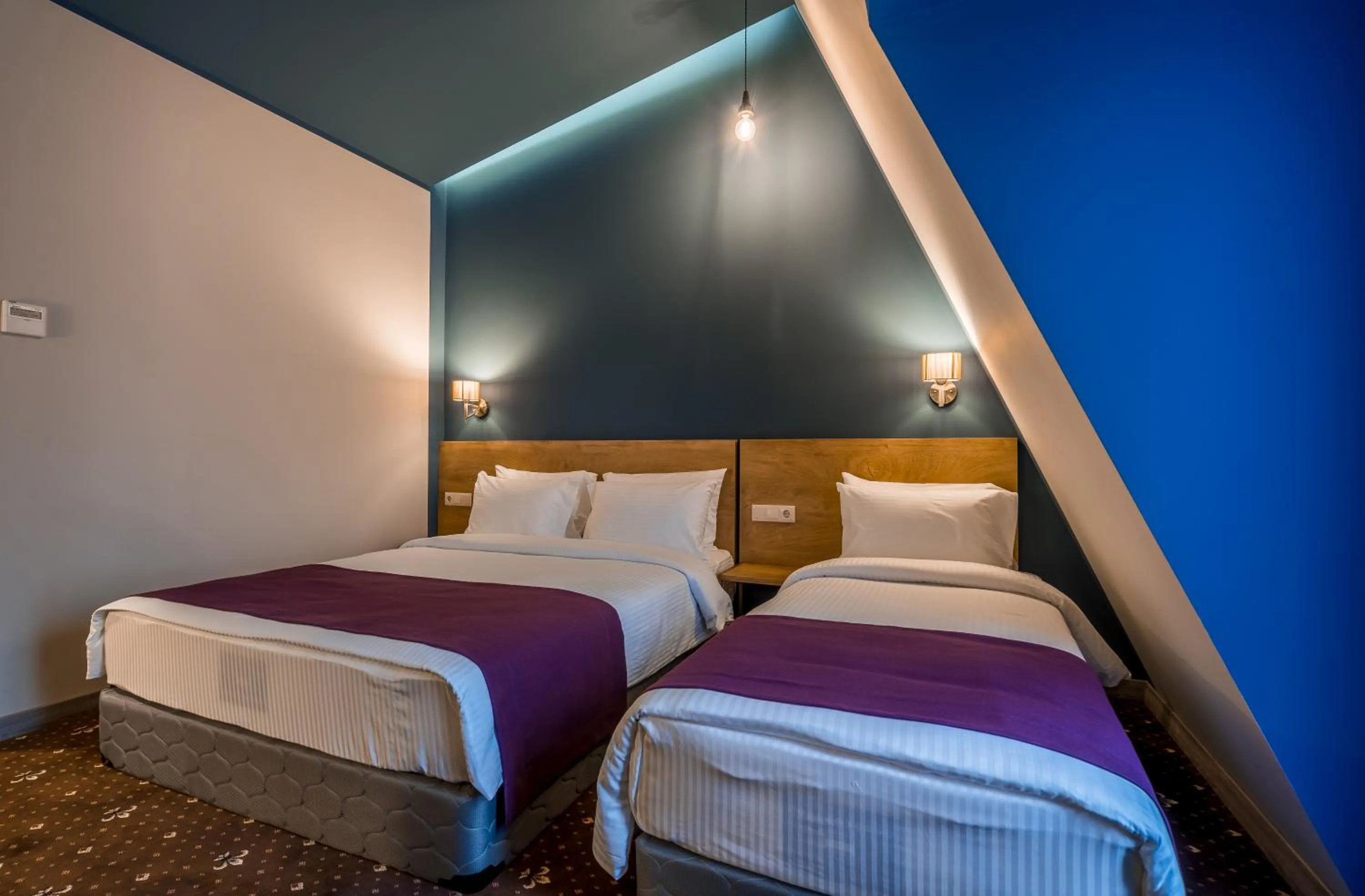 Bed in Gladius Inn Boutique Hotel by DNT Group